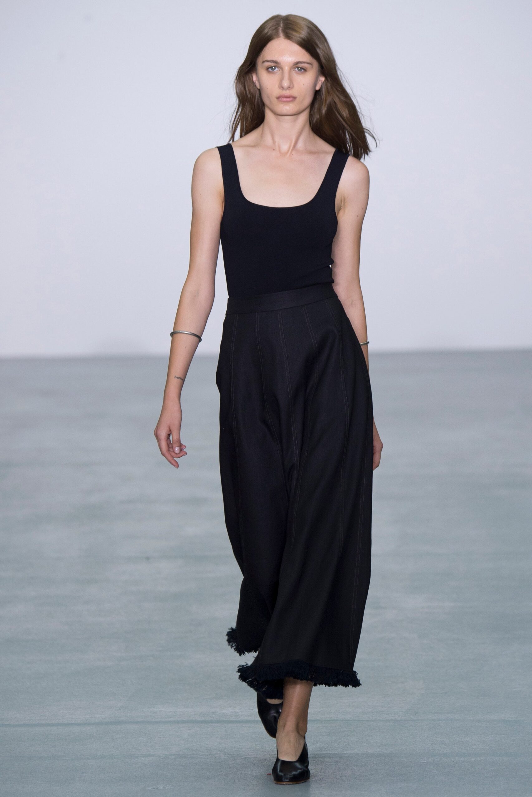 black fitted top and wide-leg pants