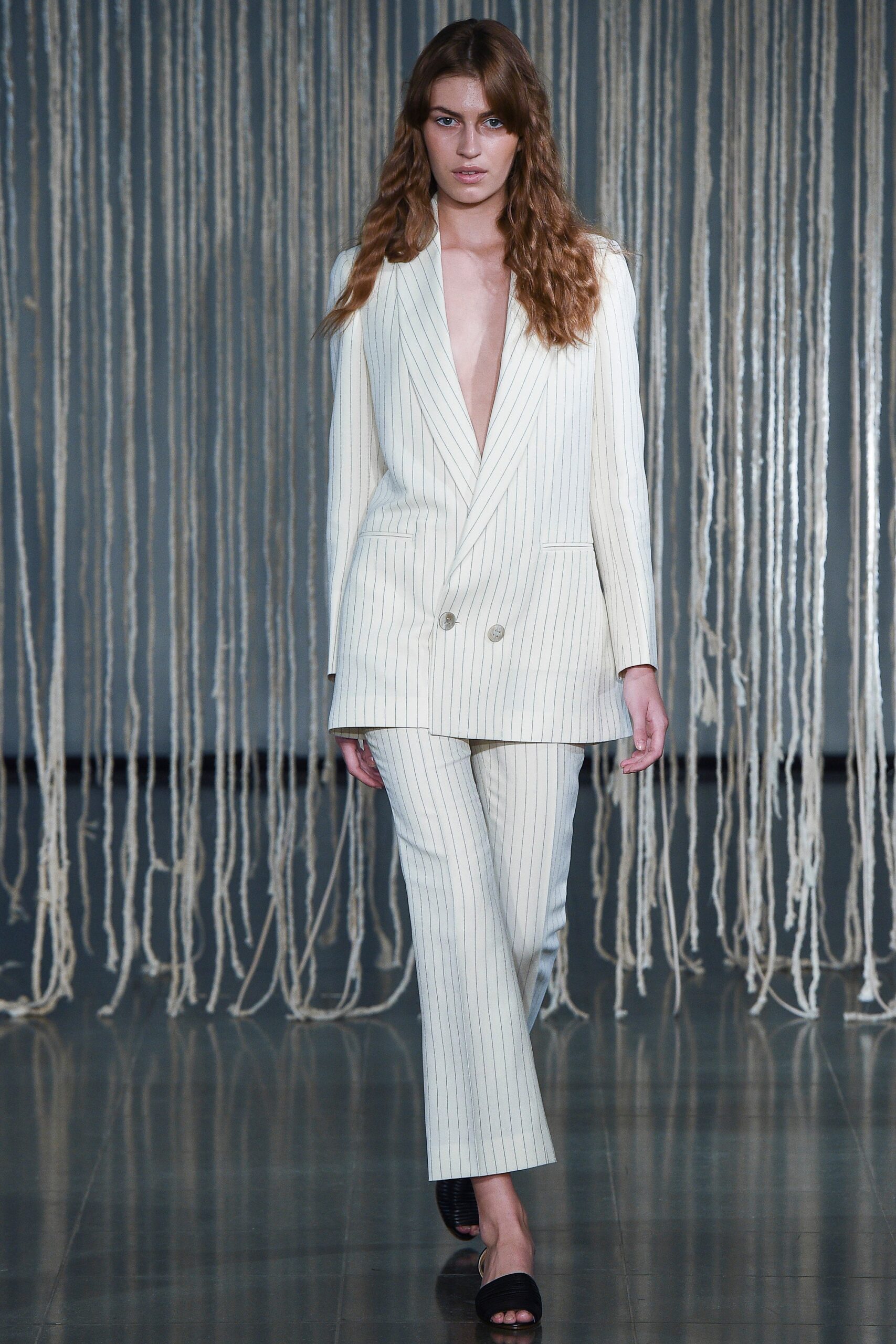white tailored suit with black shoes