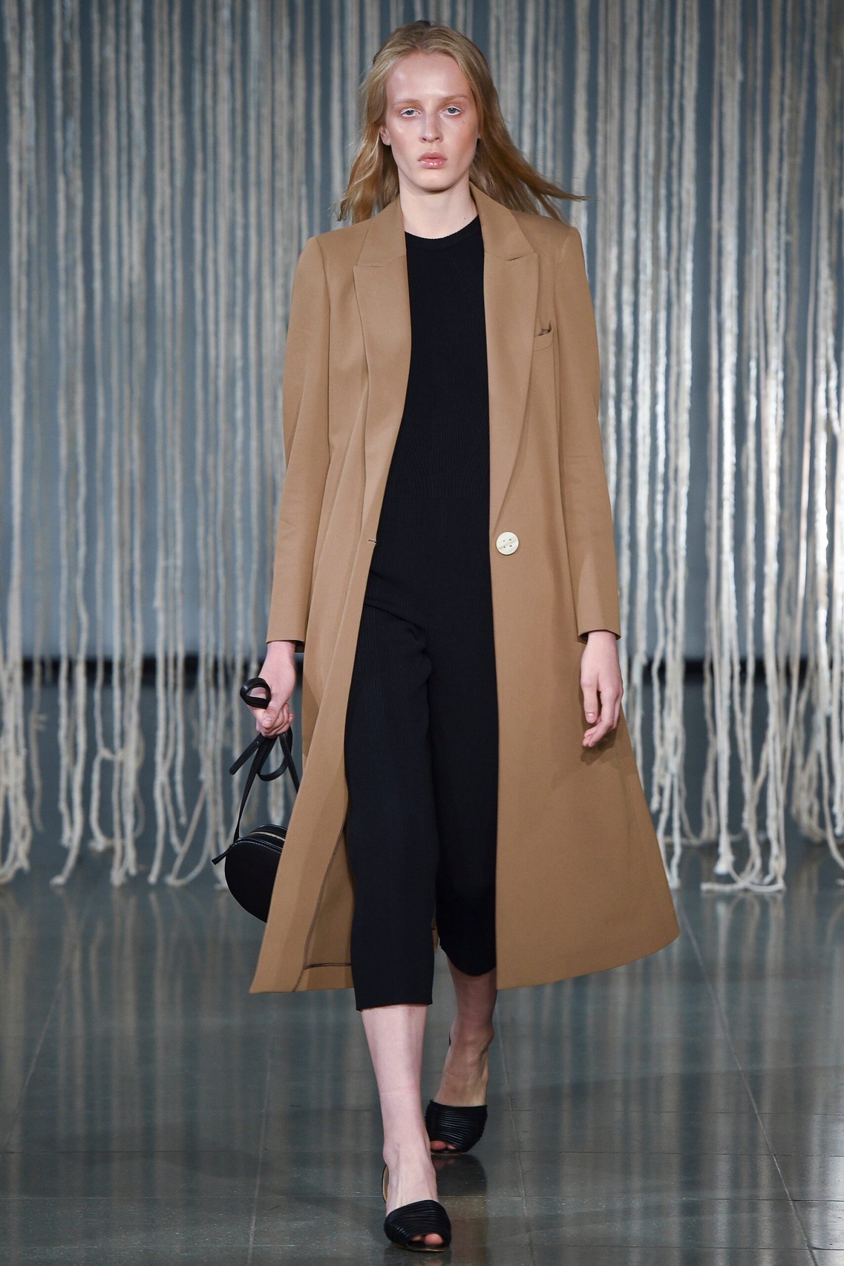 beige tailored coat black jumpsuit