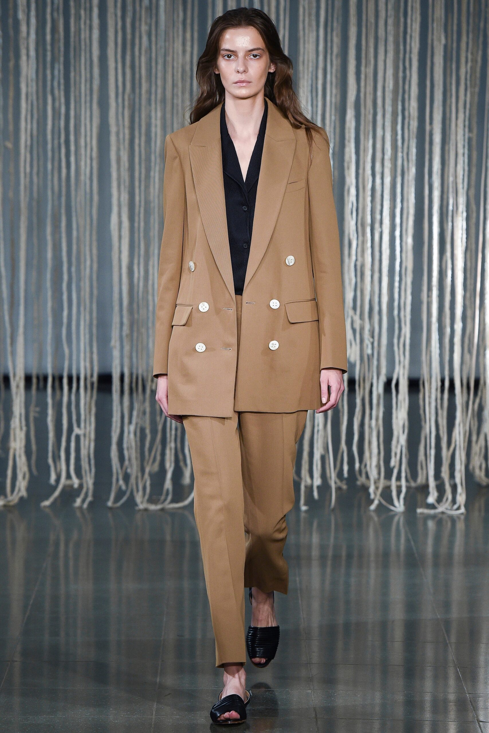beige tailored suit with black top