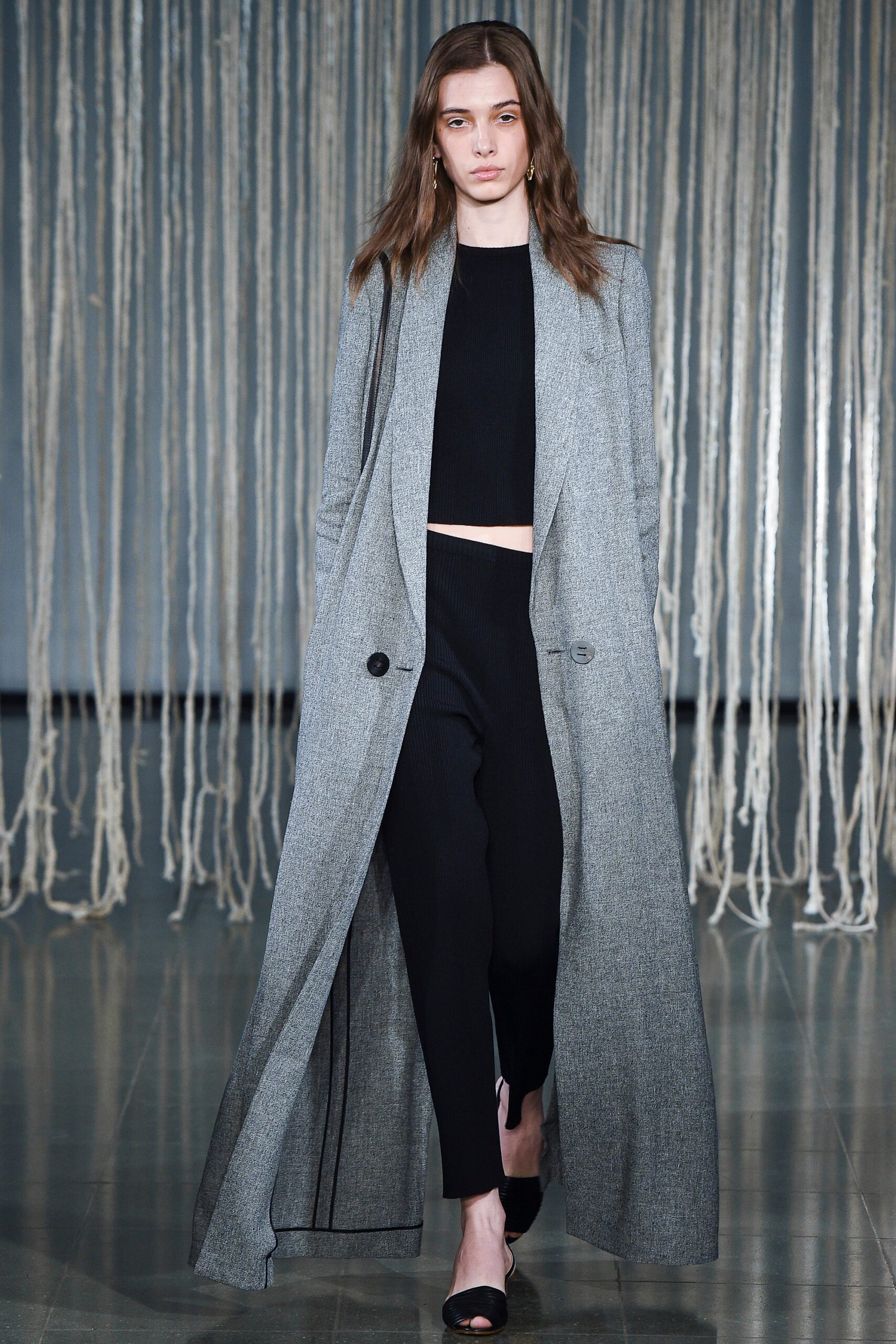 gray wool coat with black top and pants