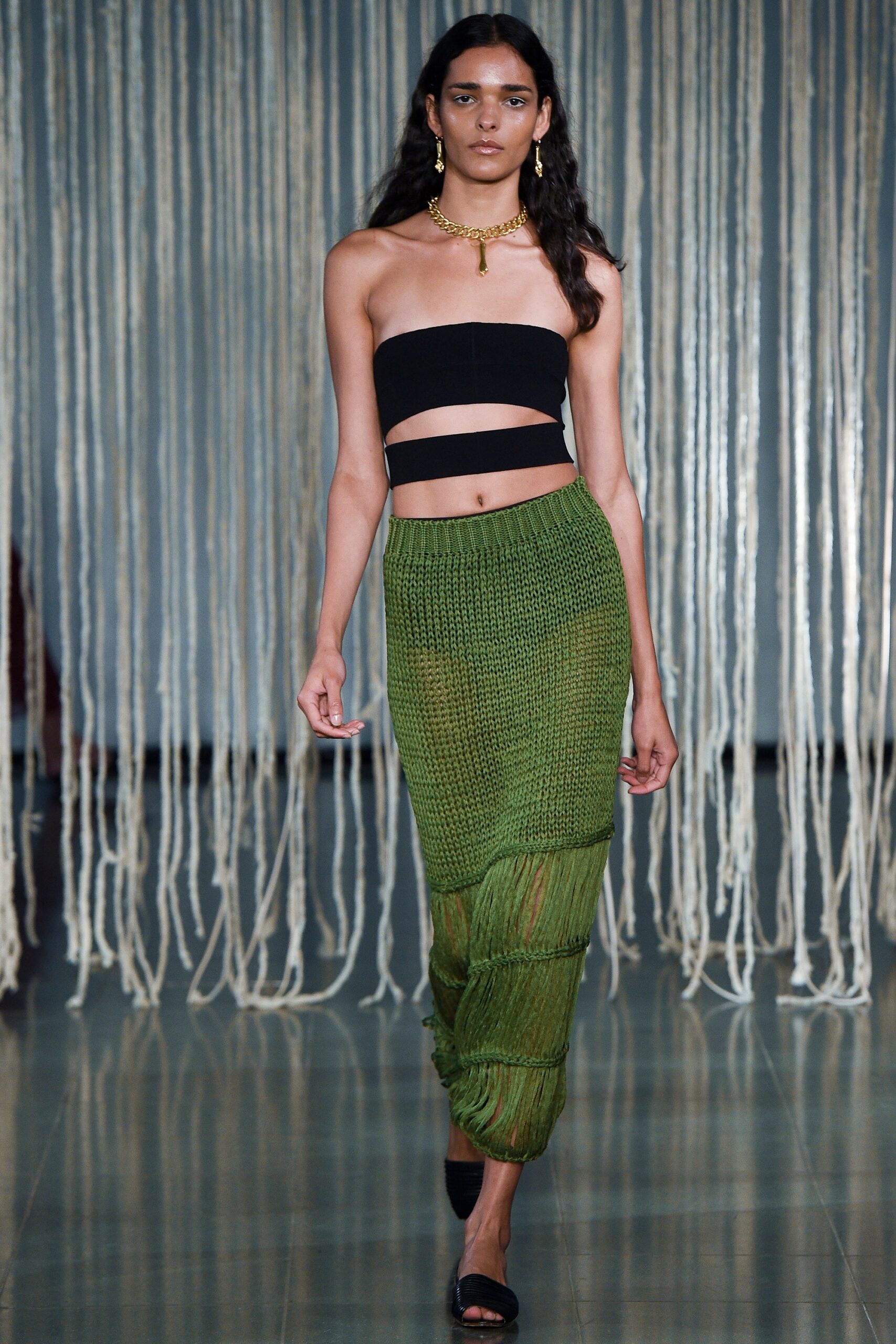 black fitted crop top and green midi skirt