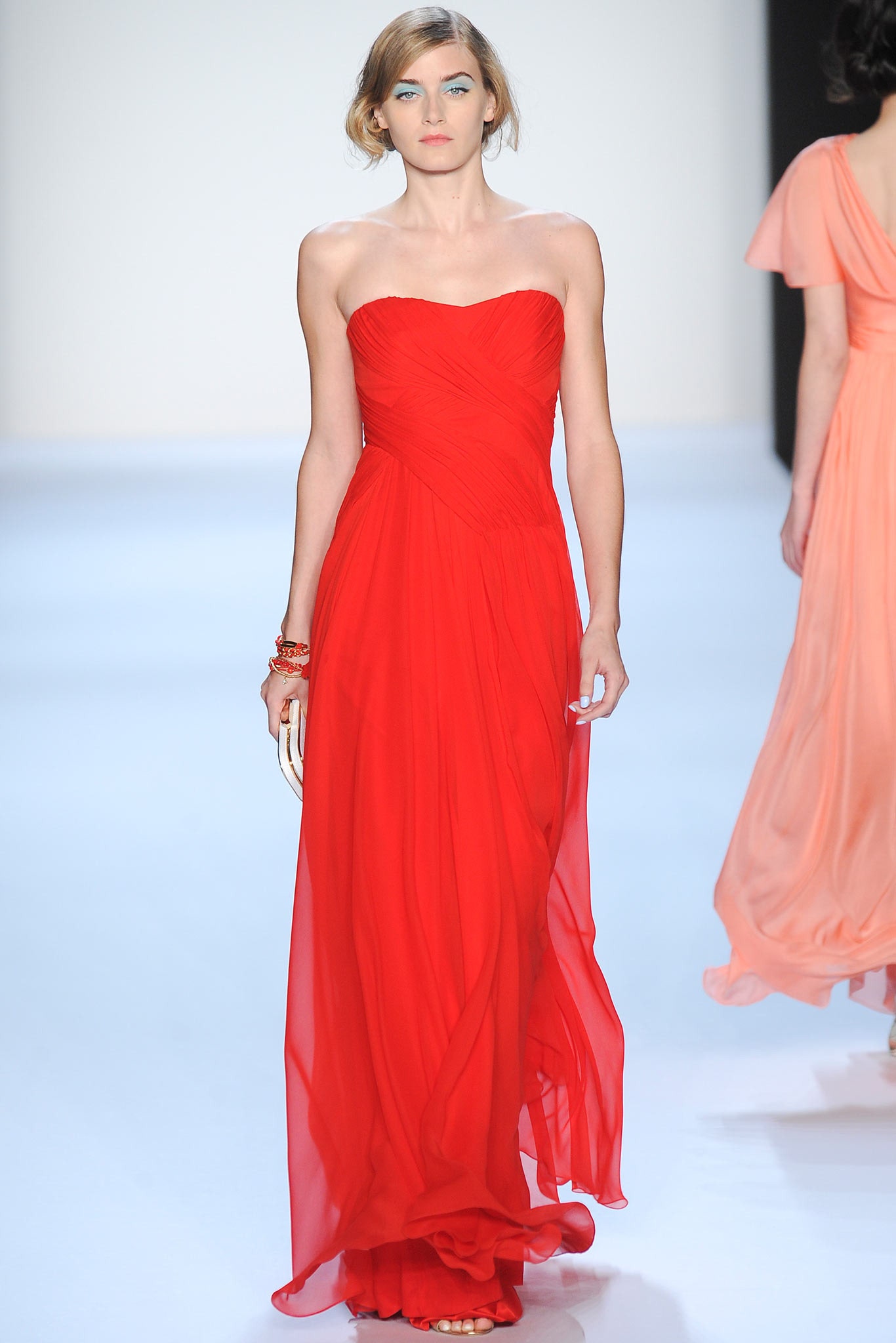 red strapless flowing gown