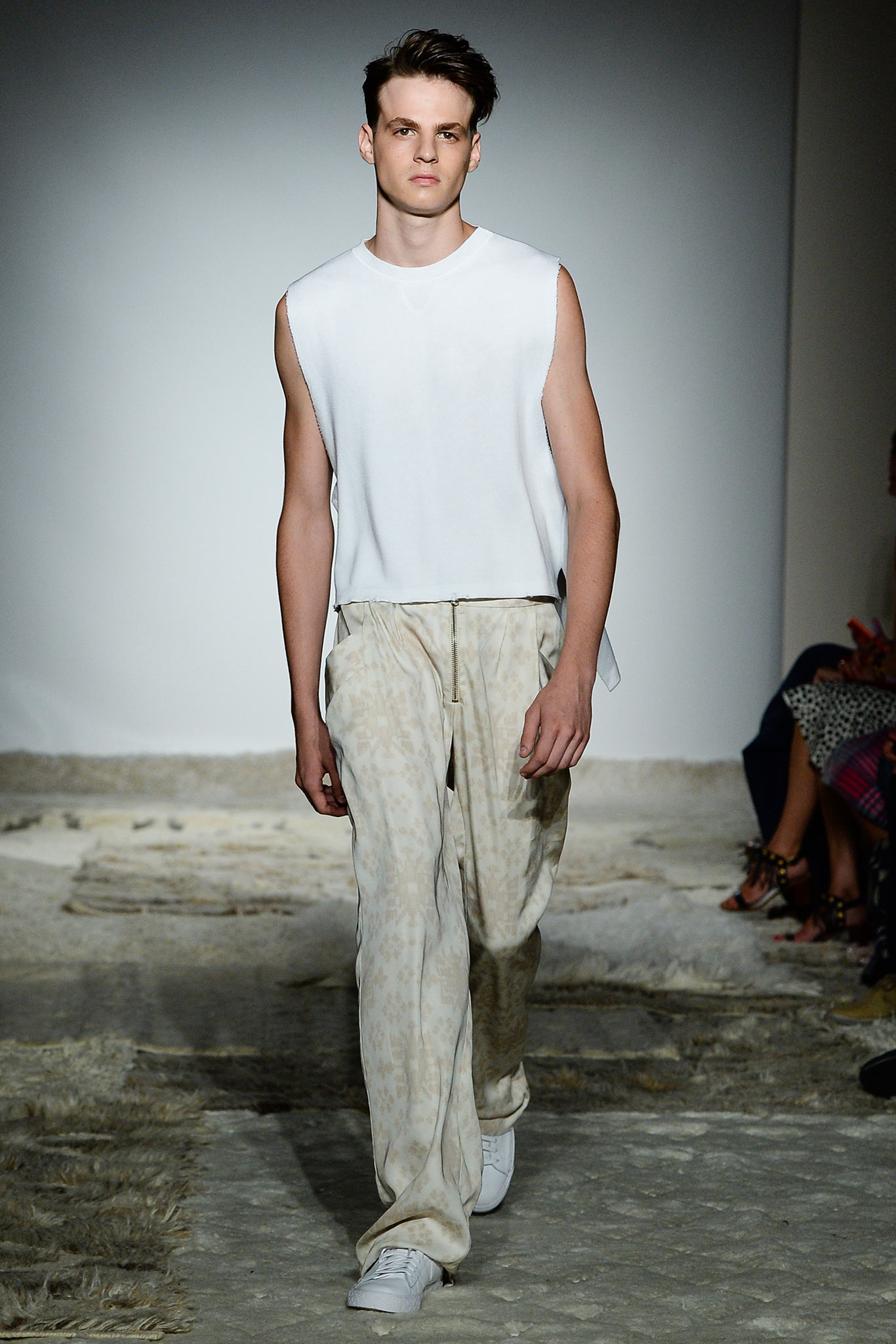 white sleeveless top with beige pants