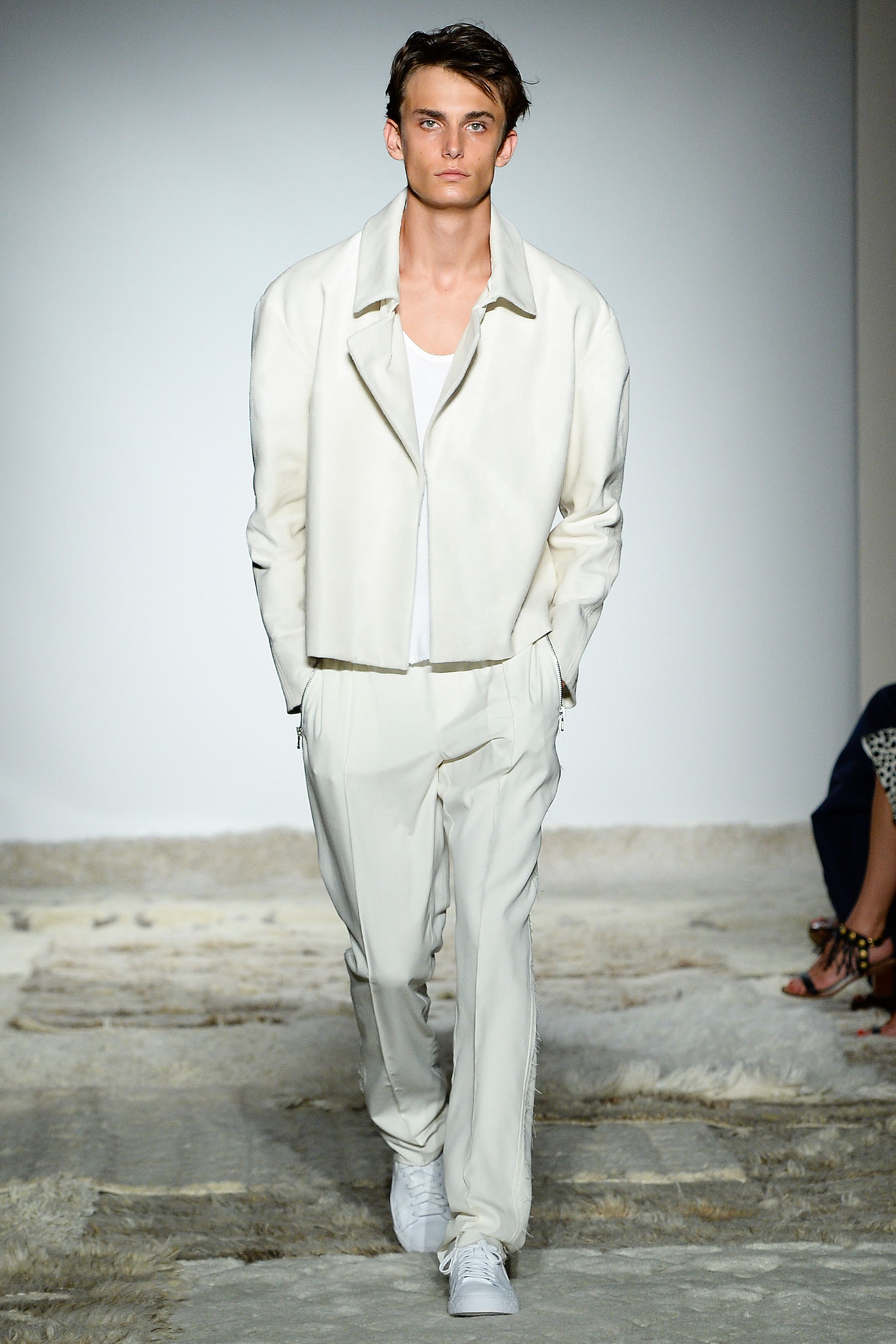 white leather jacket and tailored pants