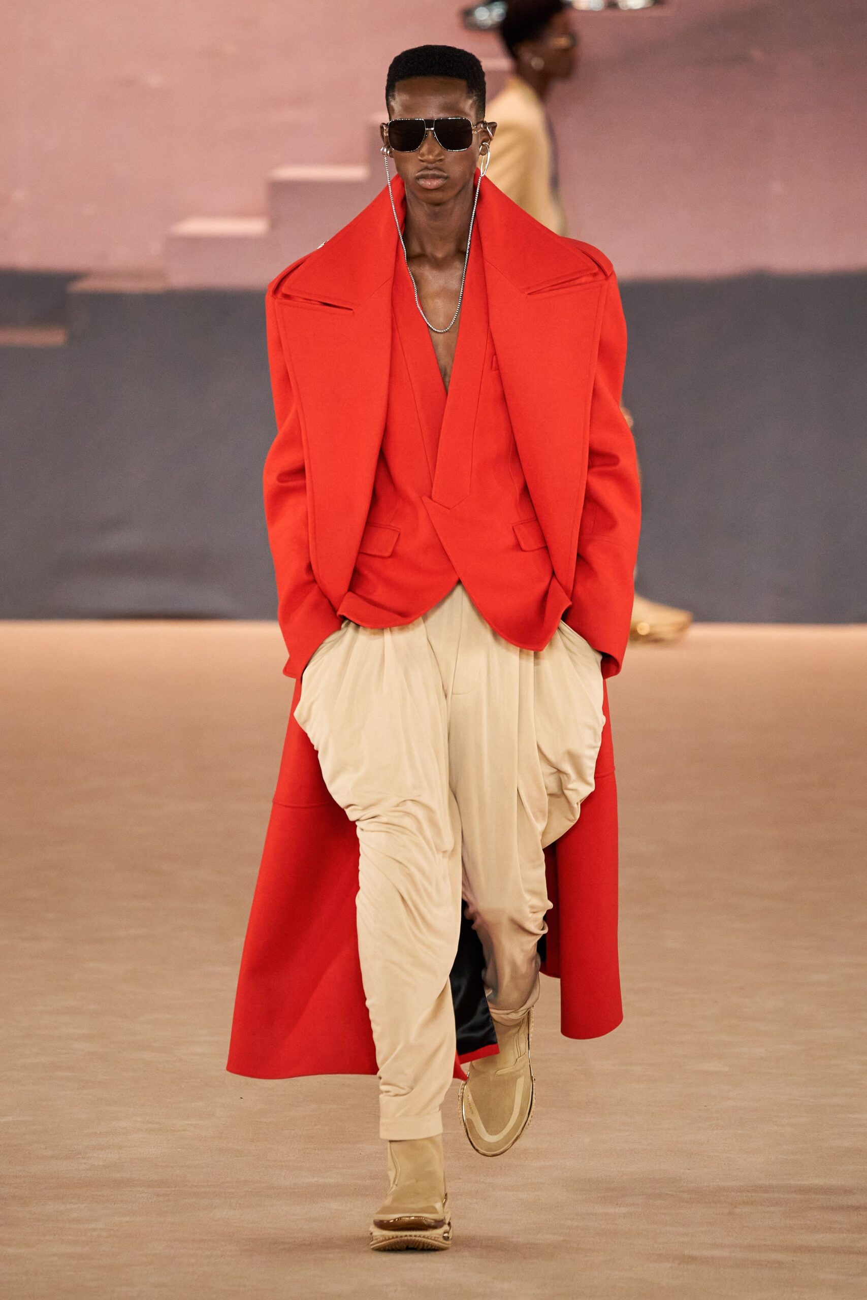 red wool long-sleeve collared oversized draped coat