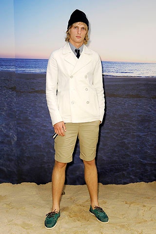 white fitted jacket with beige shorts