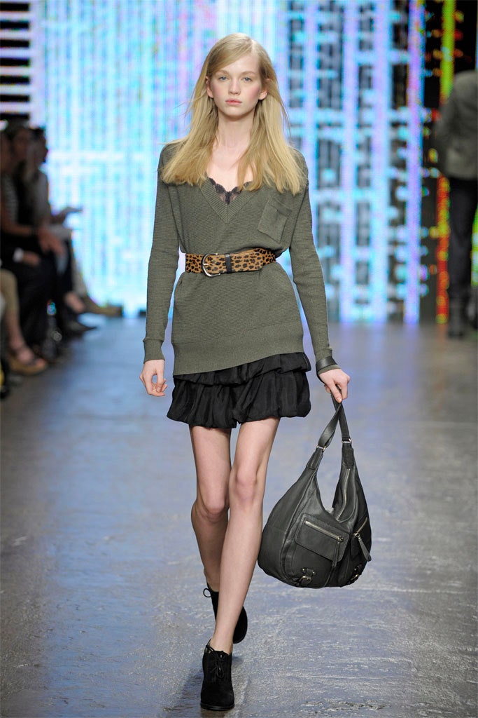 gray fitted top with black mini skirt