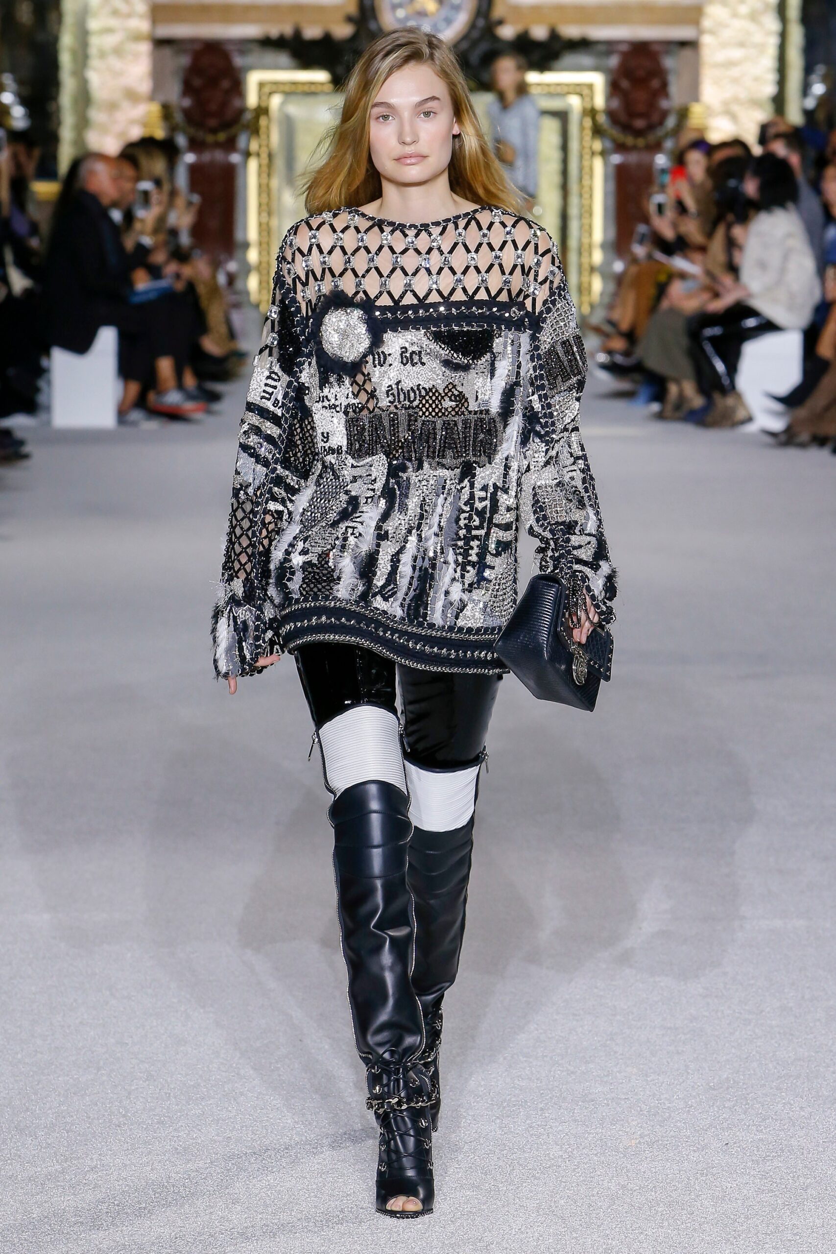 black and white embroidered top with leather pants