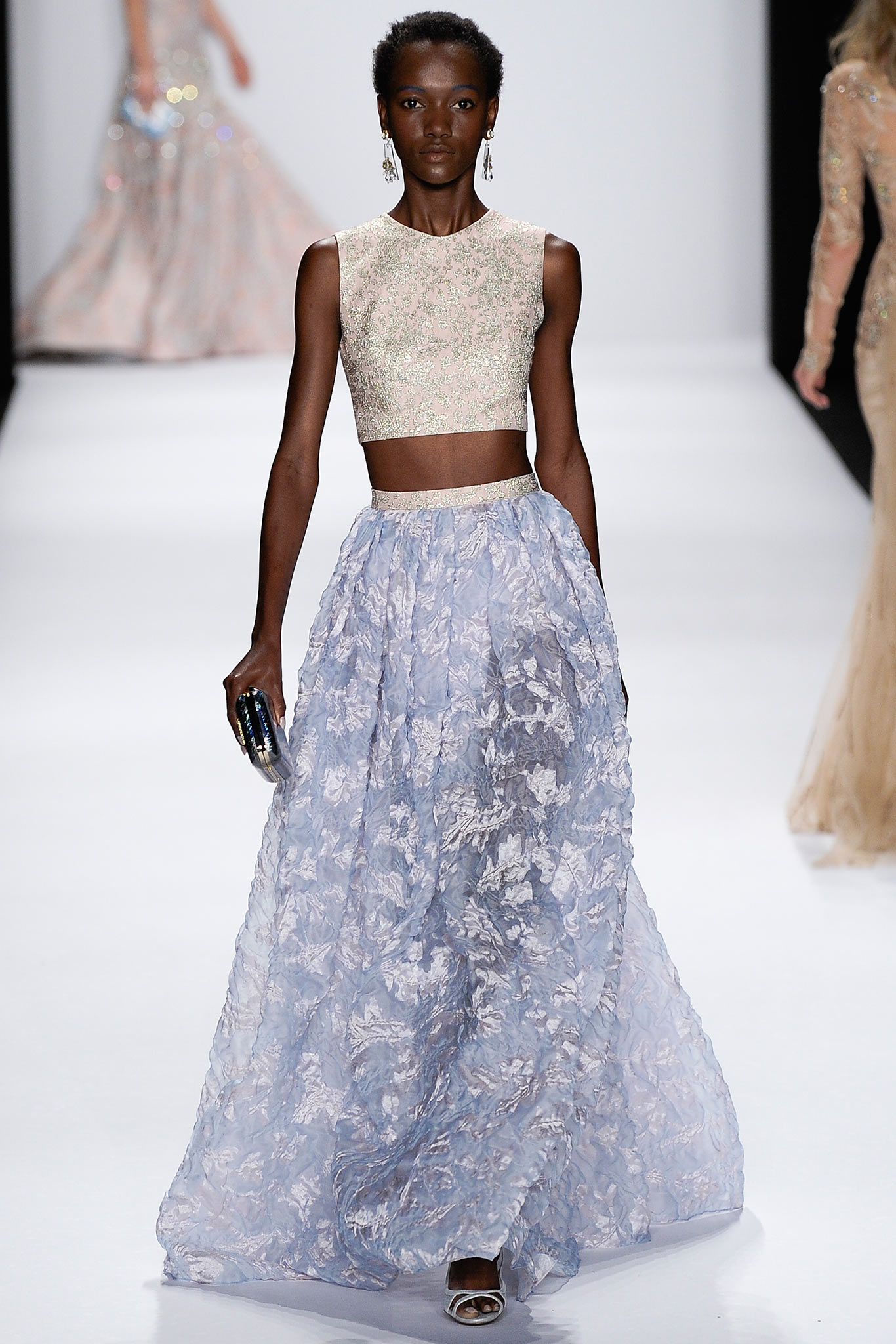 beige embroidered silk top and blue tiered tulle skirt