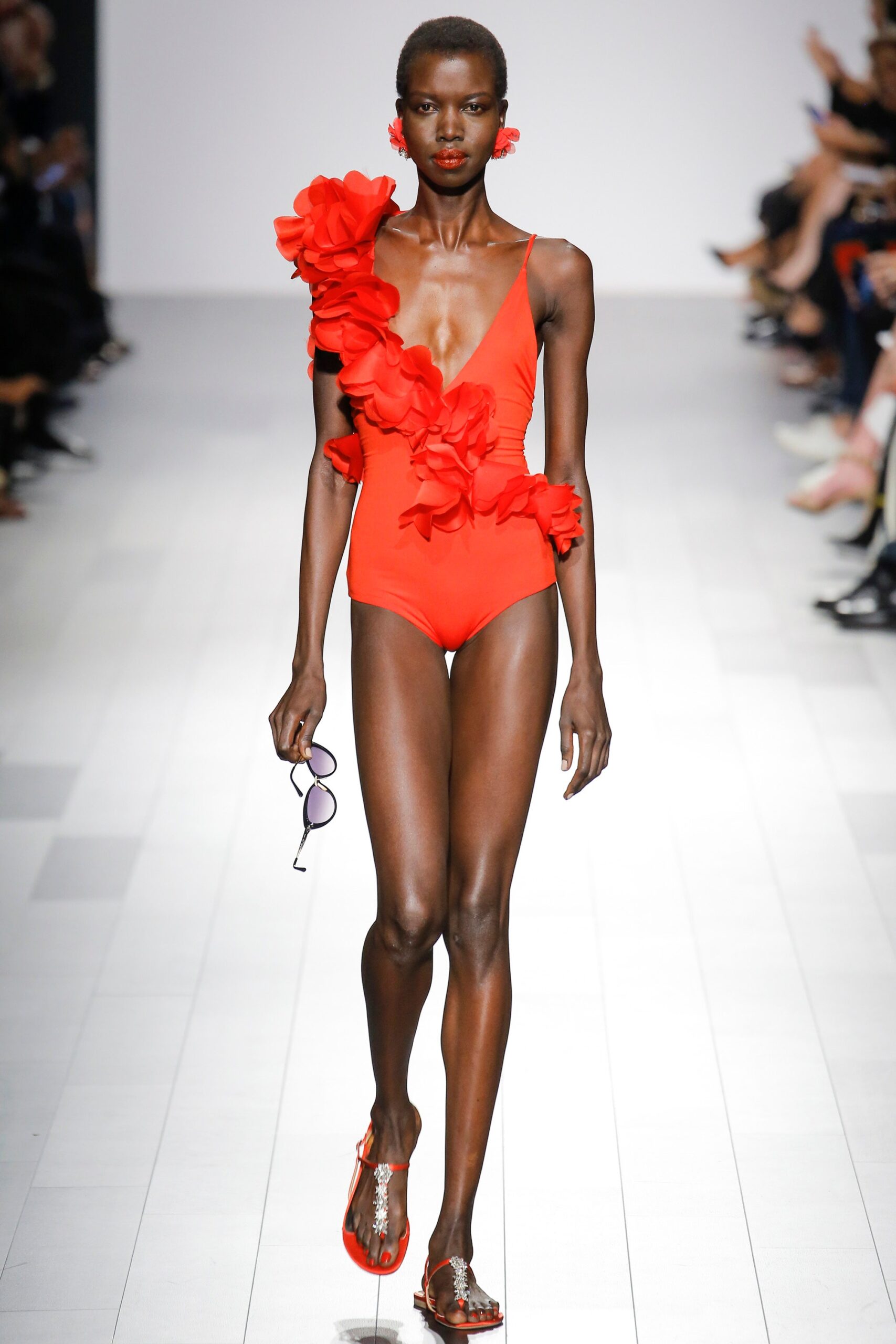 red ruffled swimsuit with clear shoes