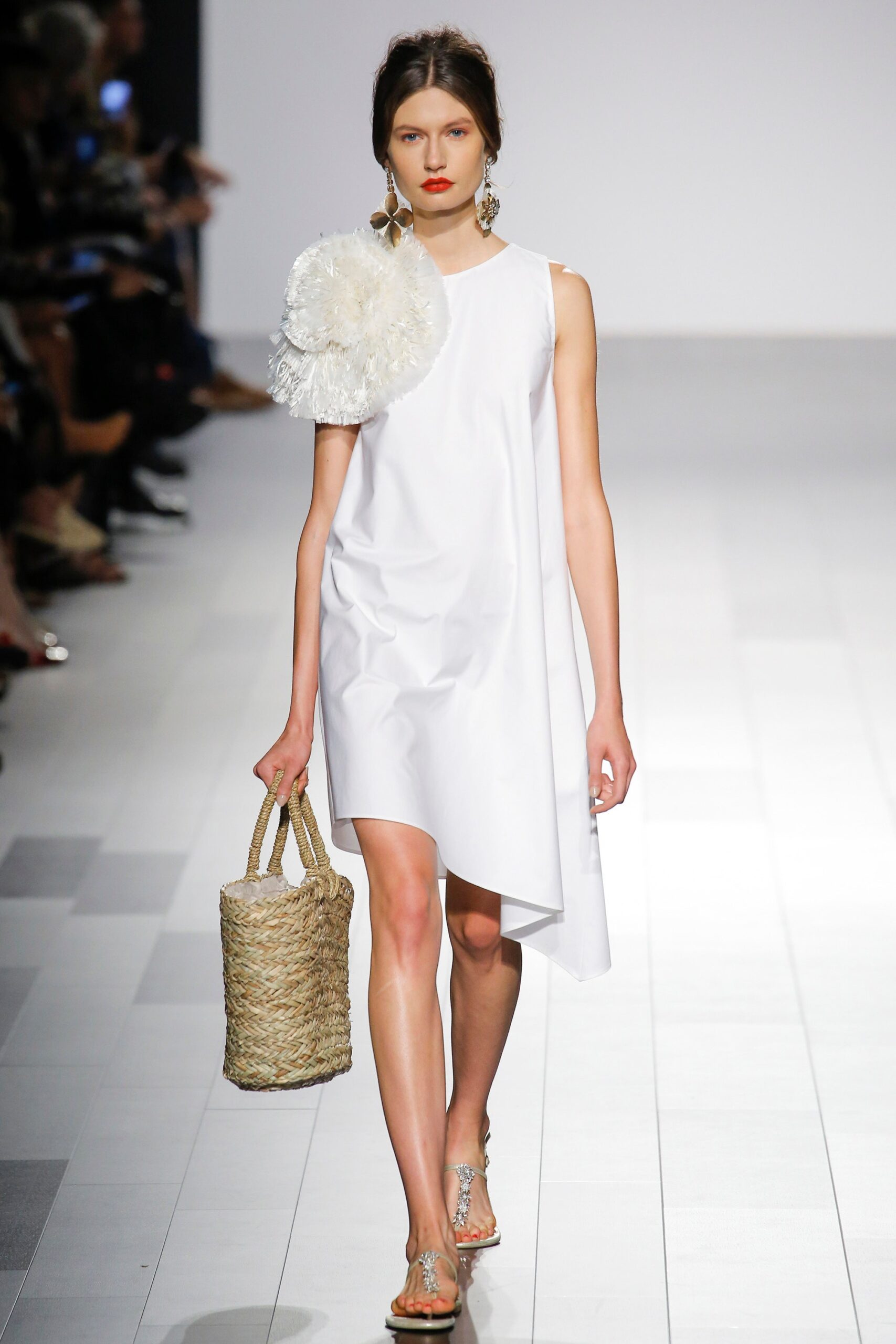 white asymmetric dress with woven bag