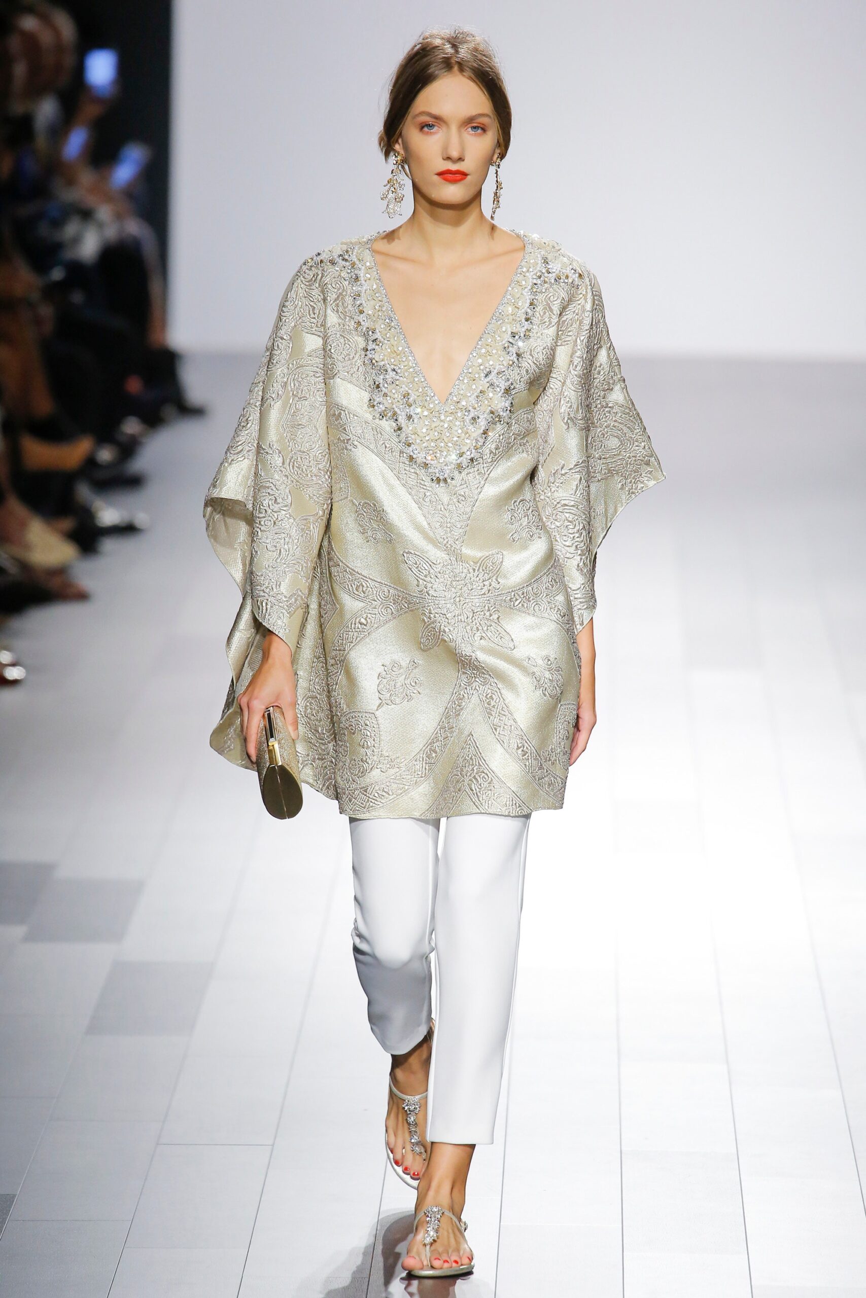gold embroidered top with white pants