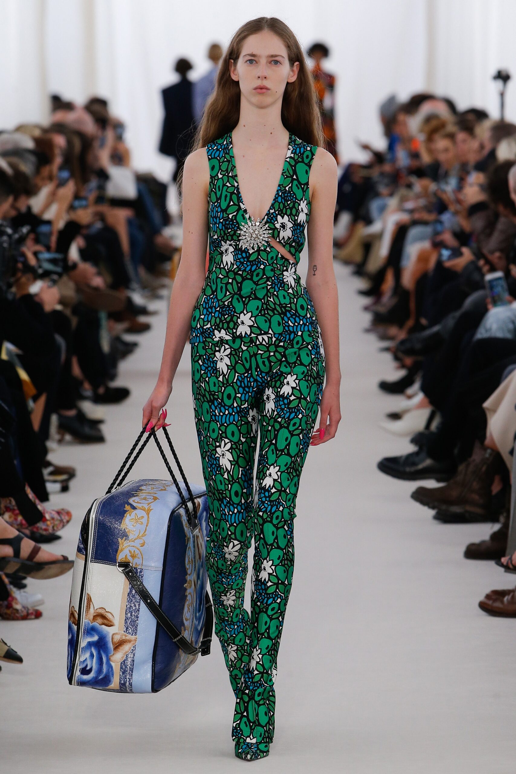 green printed catsuit with bag