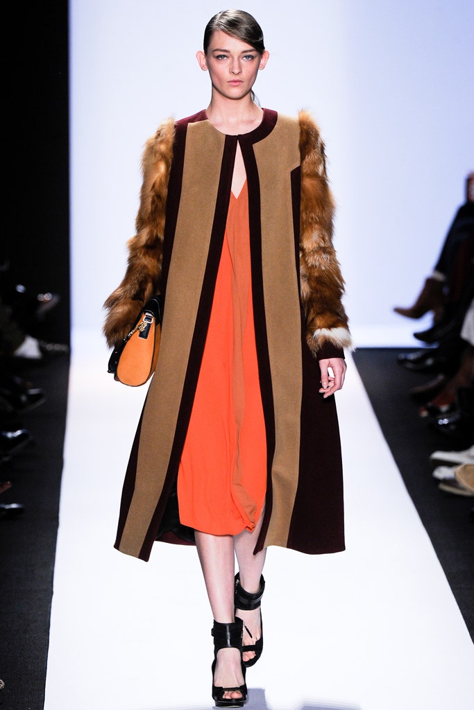 brown color-blocked coat and orange dress
