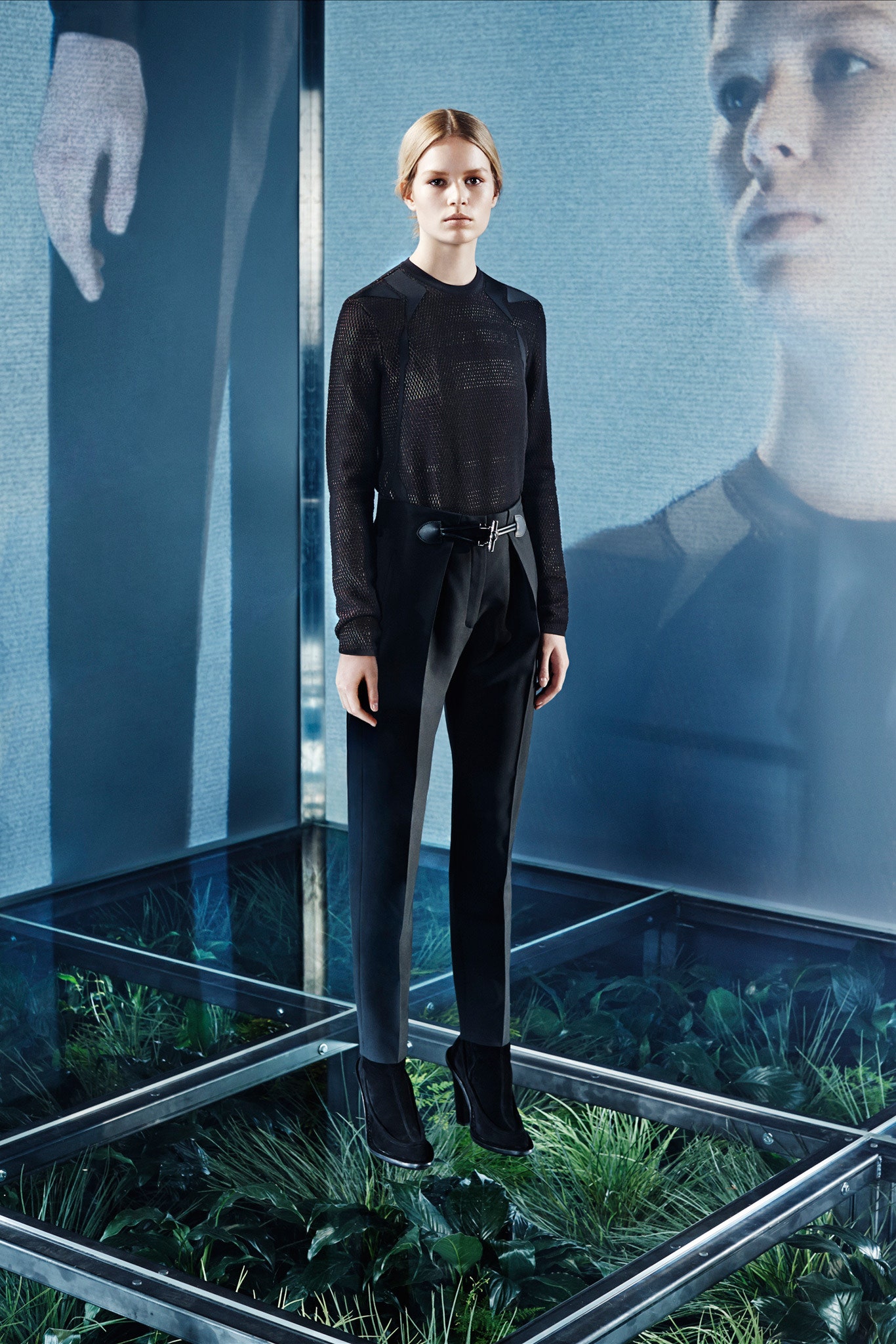 black fitted mesh top and tailored pants