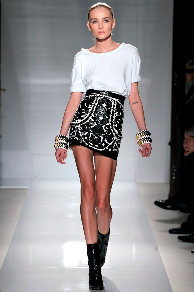white relaxed top with black mini skirt