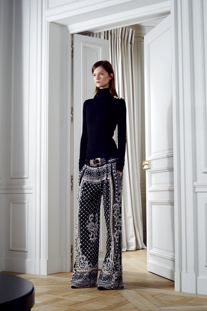 black fitted turtleneck top with flared pants