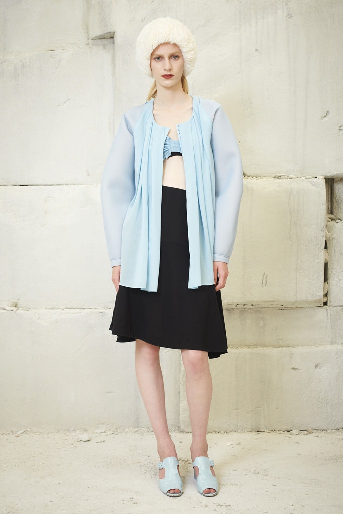 blue silk sleeveless top and black mini skirt