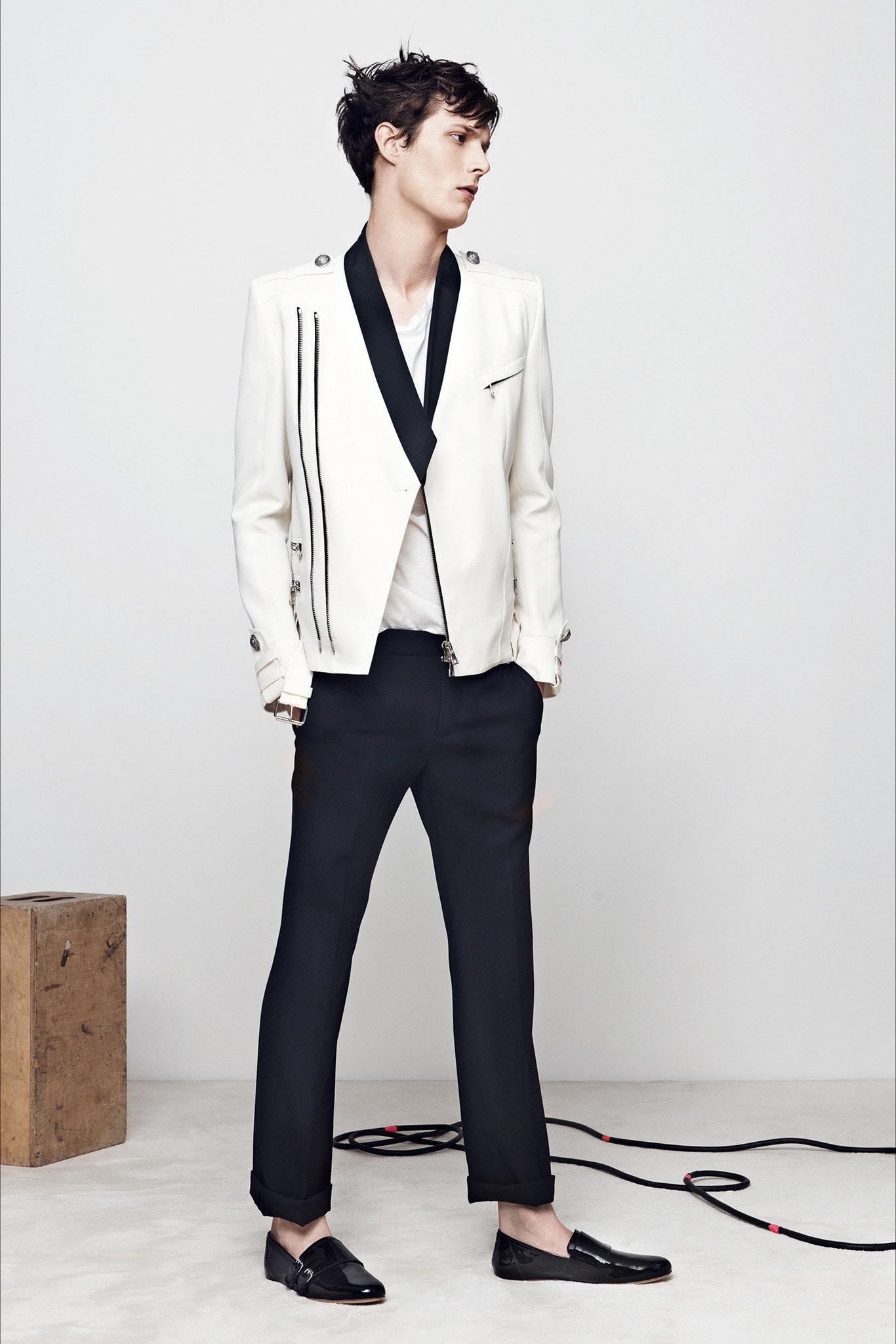fitted white leather jacket and black tailored pants
