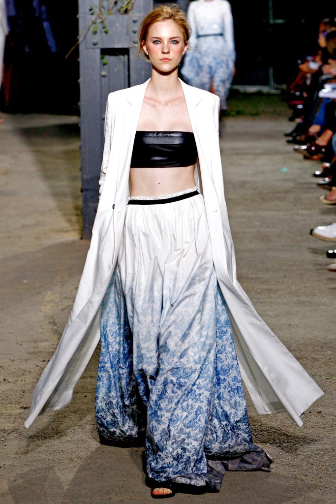 white coat black leather top blue skirt