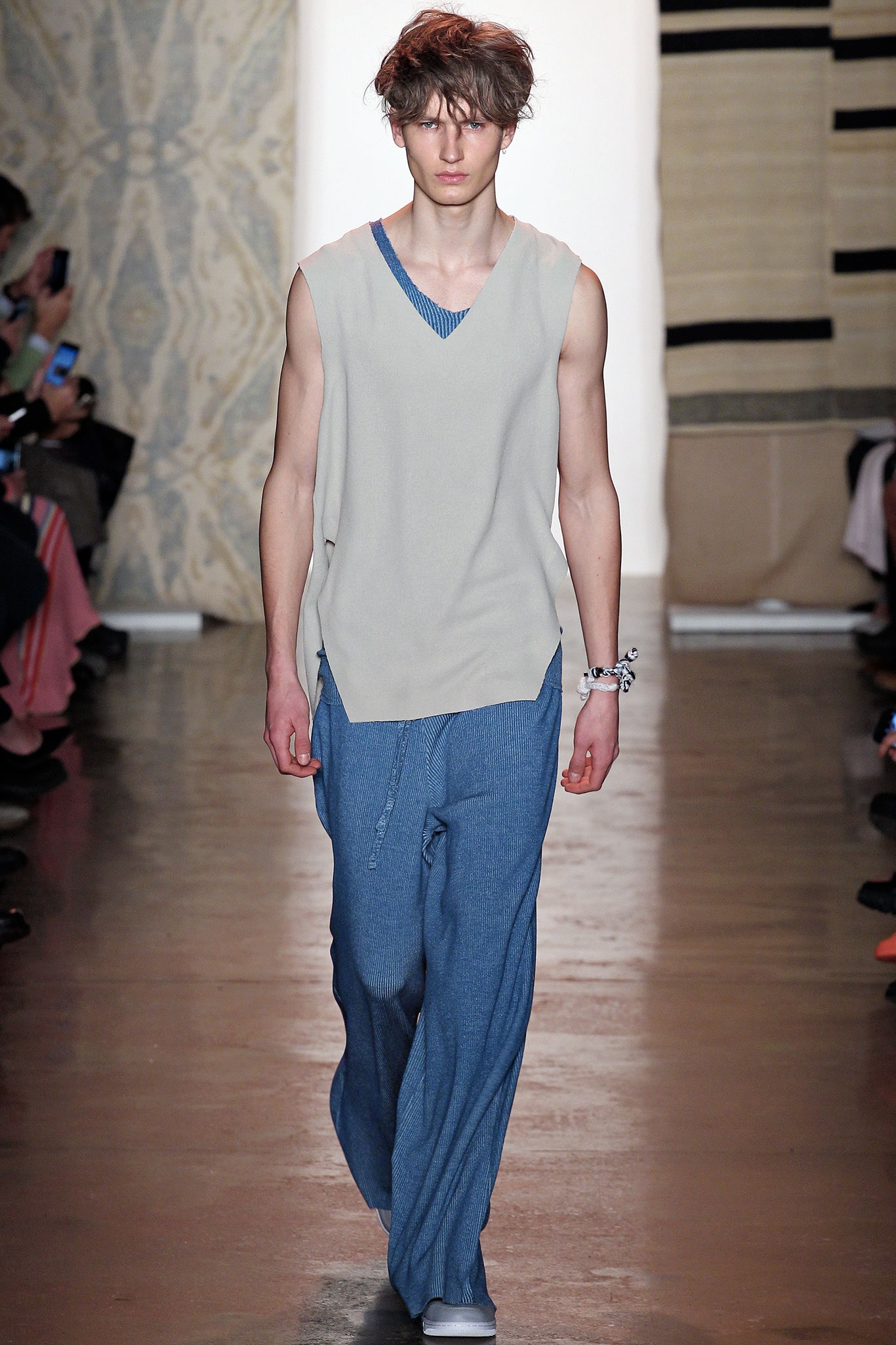 gray sleeveless top with blue pants
