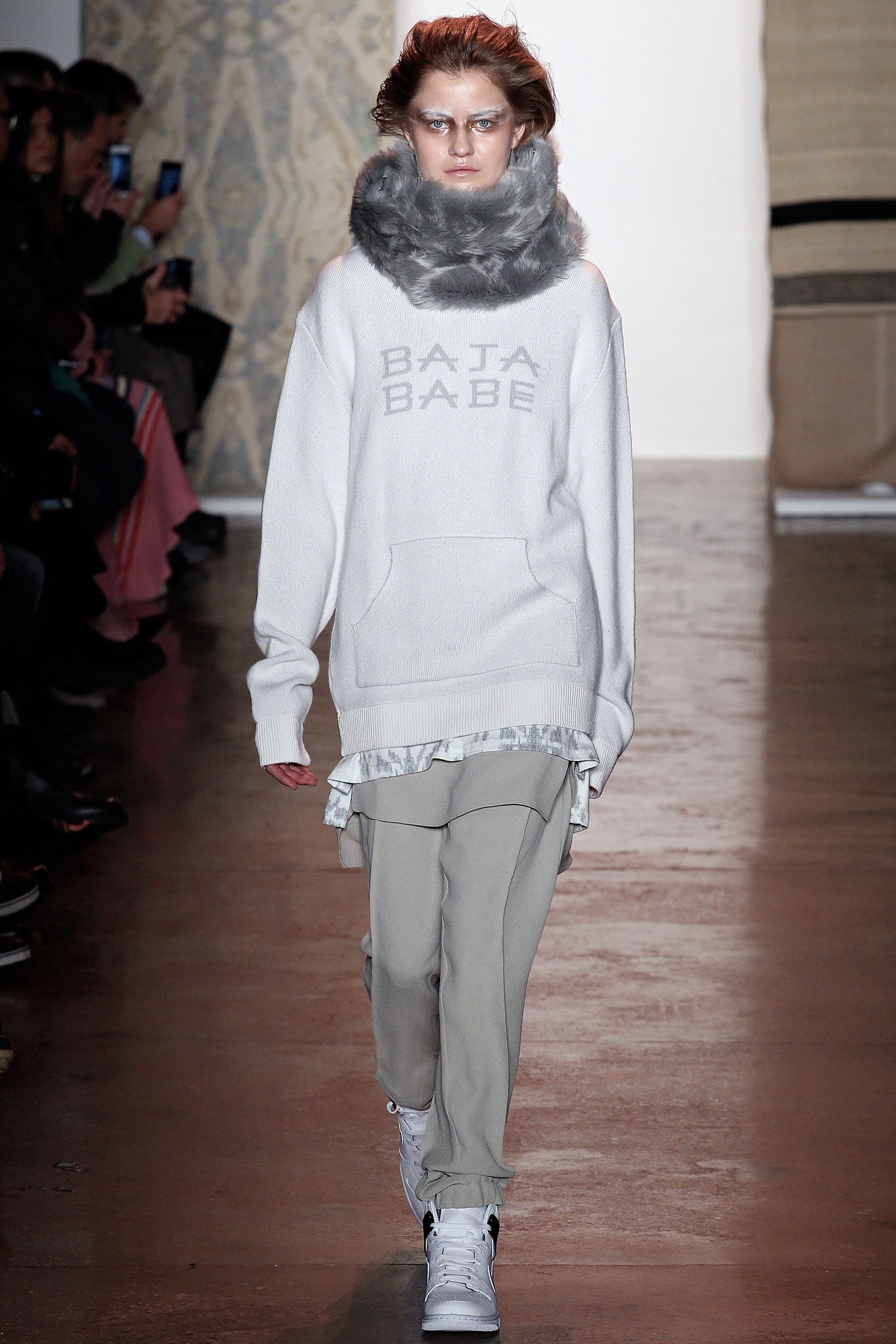 white relaxed sweater with gray pants