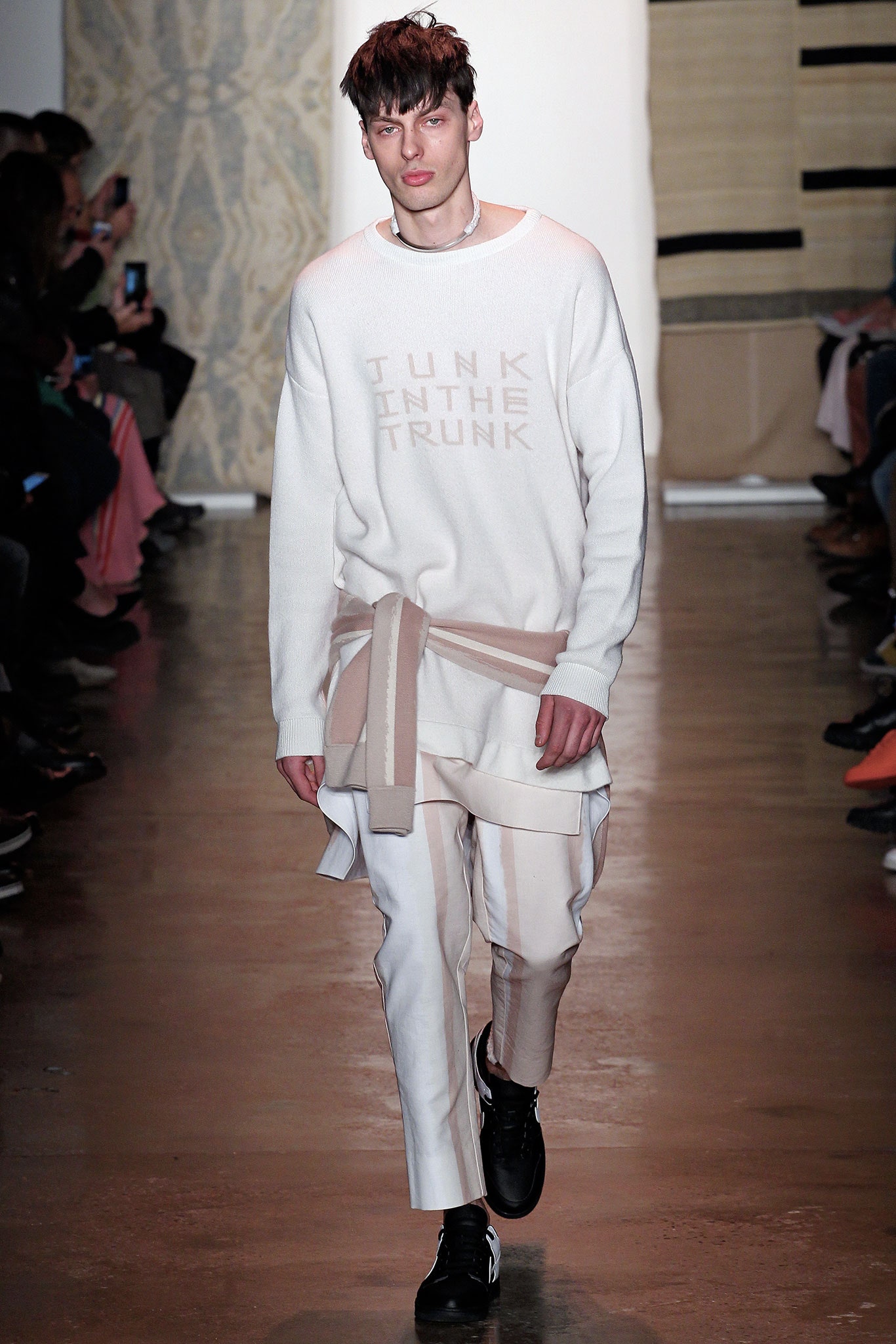 white relaxed sweater with beige pants