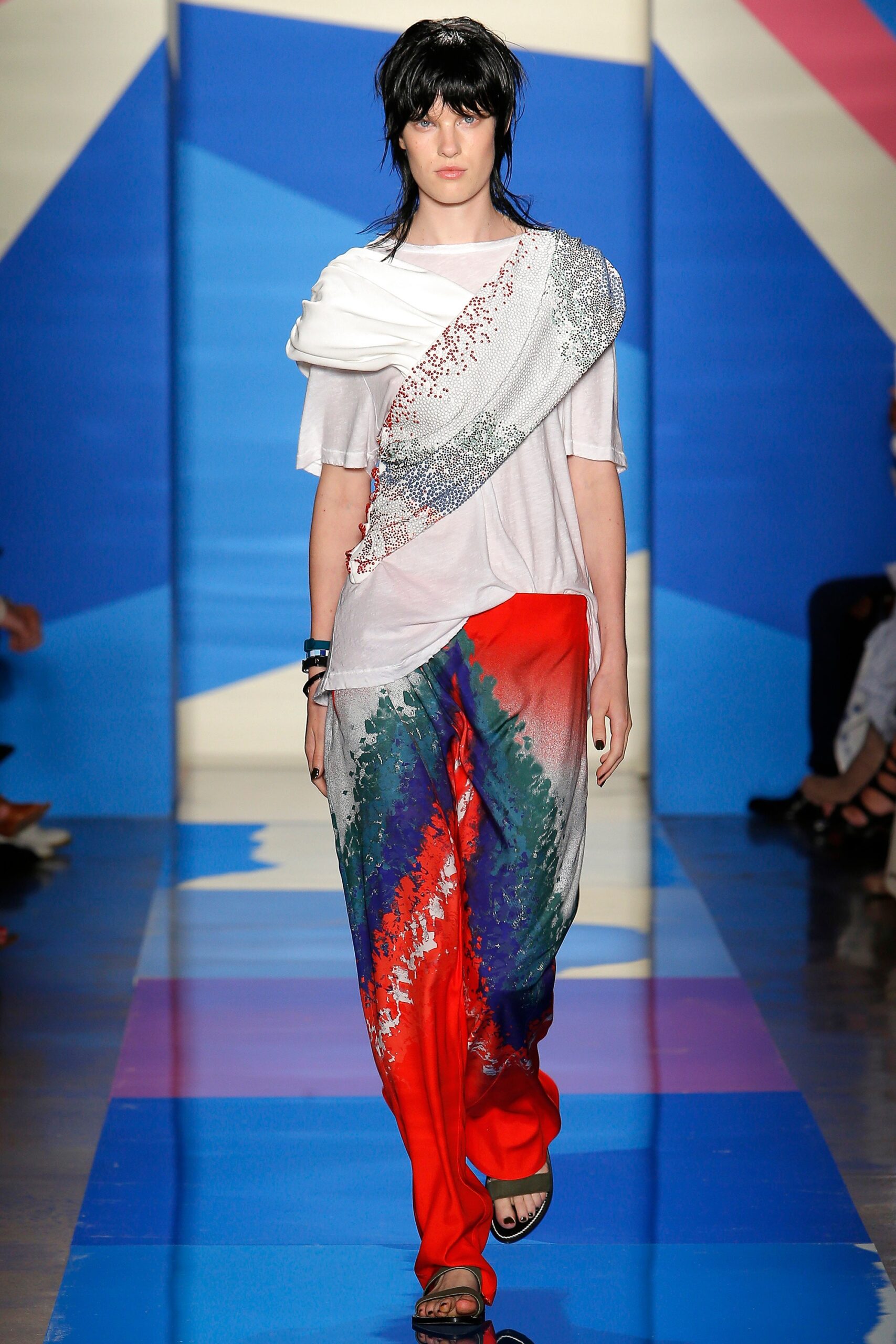 asymmetric white top with flared pants