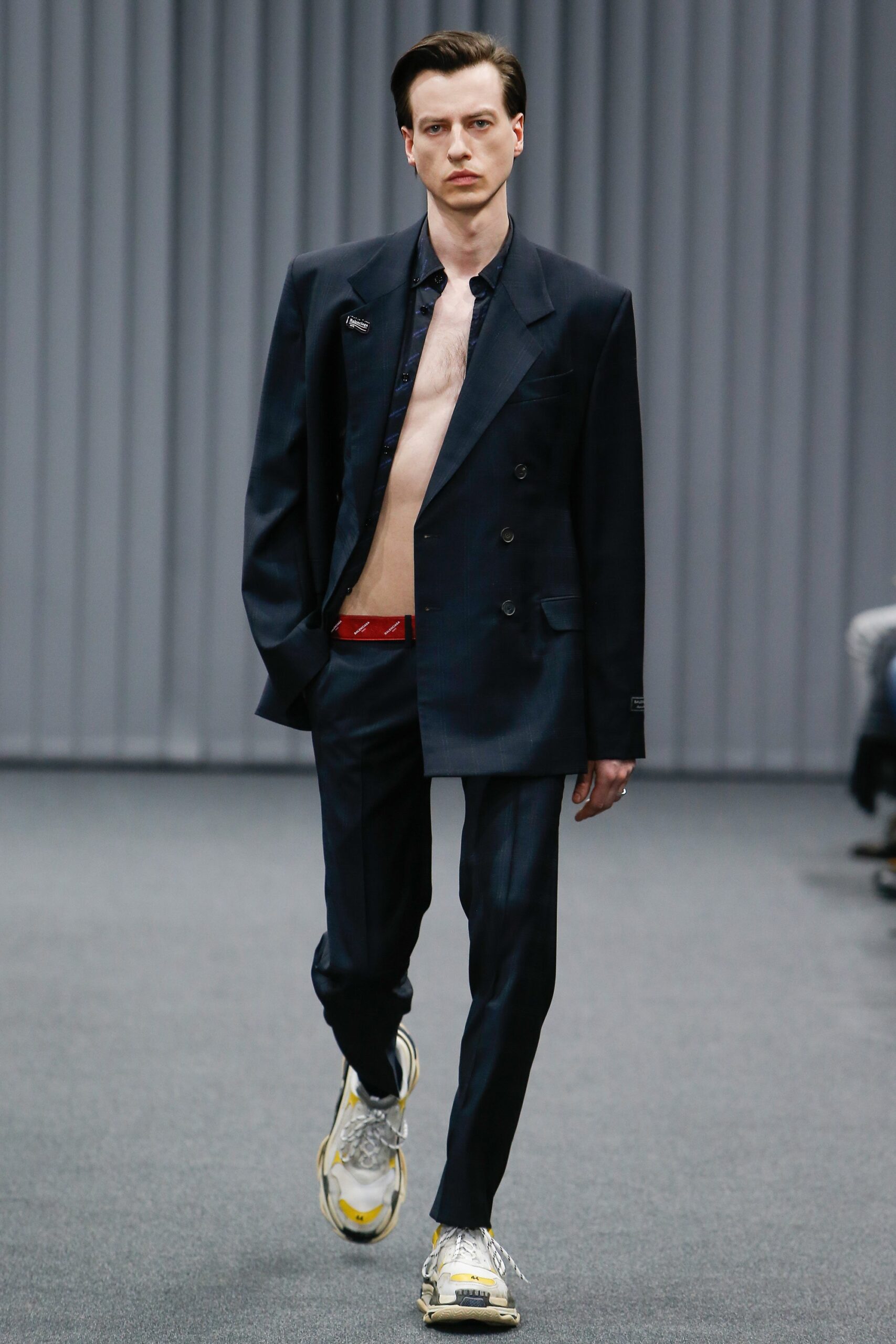 black tailored suit with metallic shoes