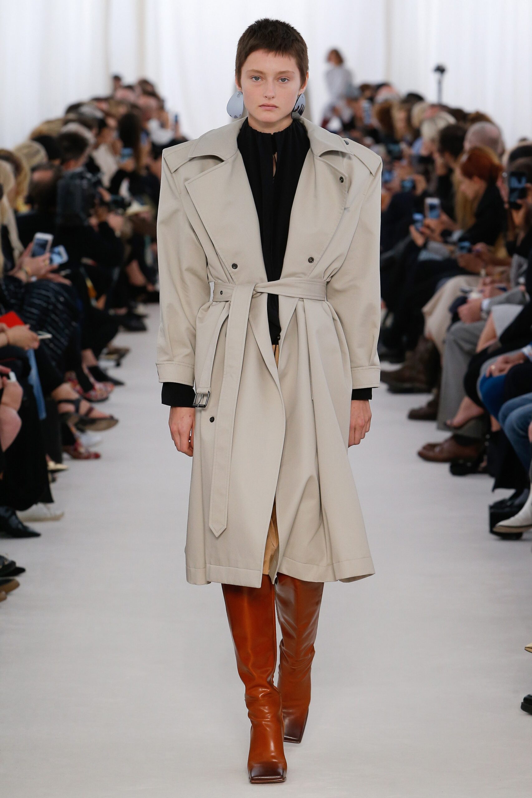 beige cotton trench coat with brown boots