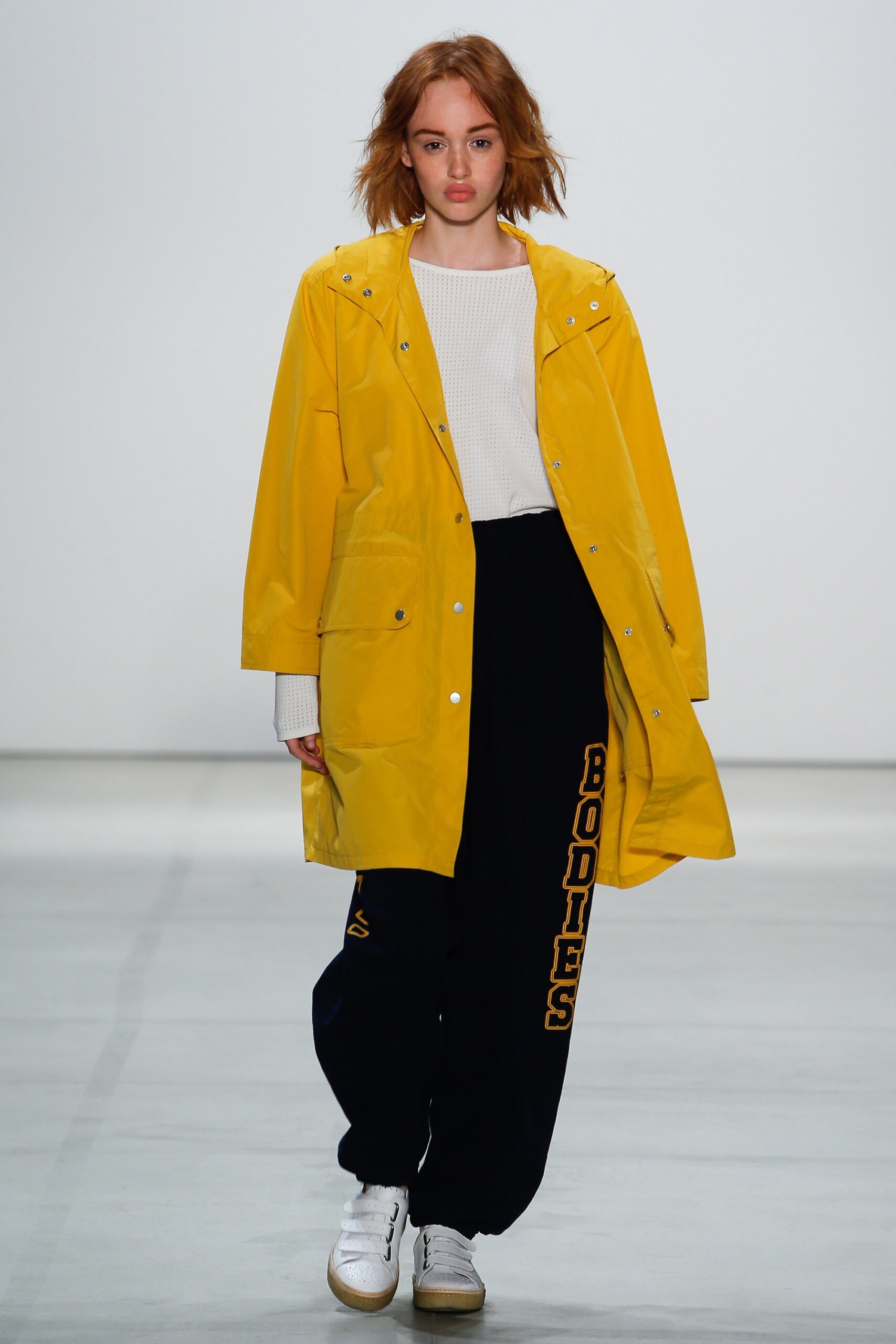 yellow vinyl coat with black pants