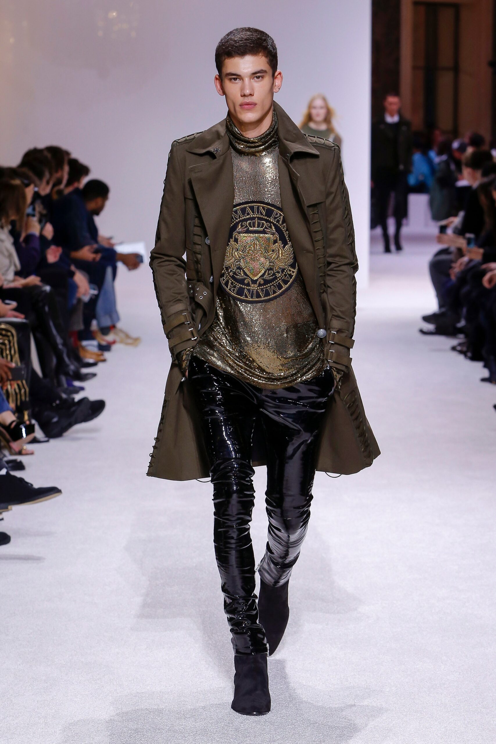 green coat gold top black pants