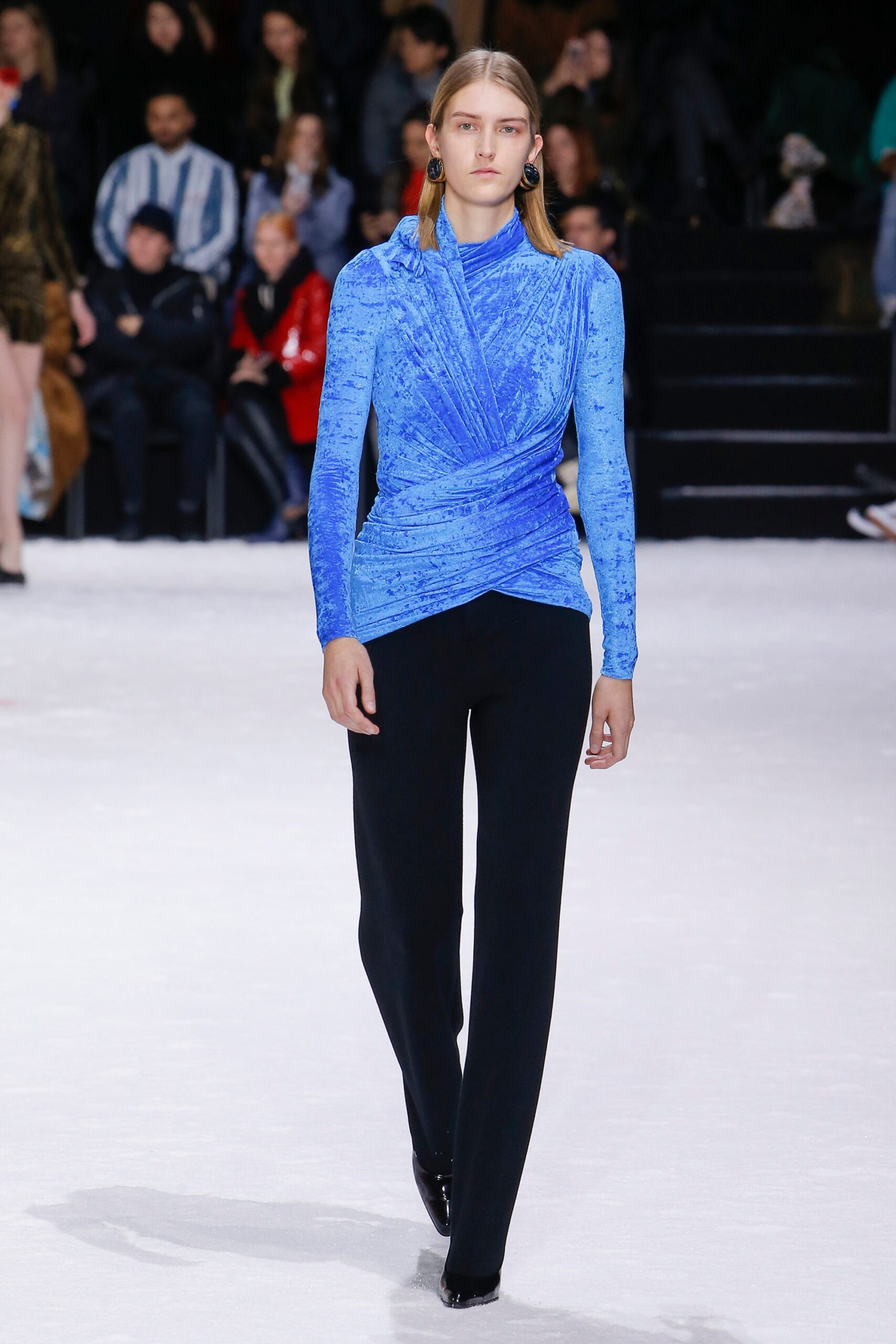 blue fitted top and black pants