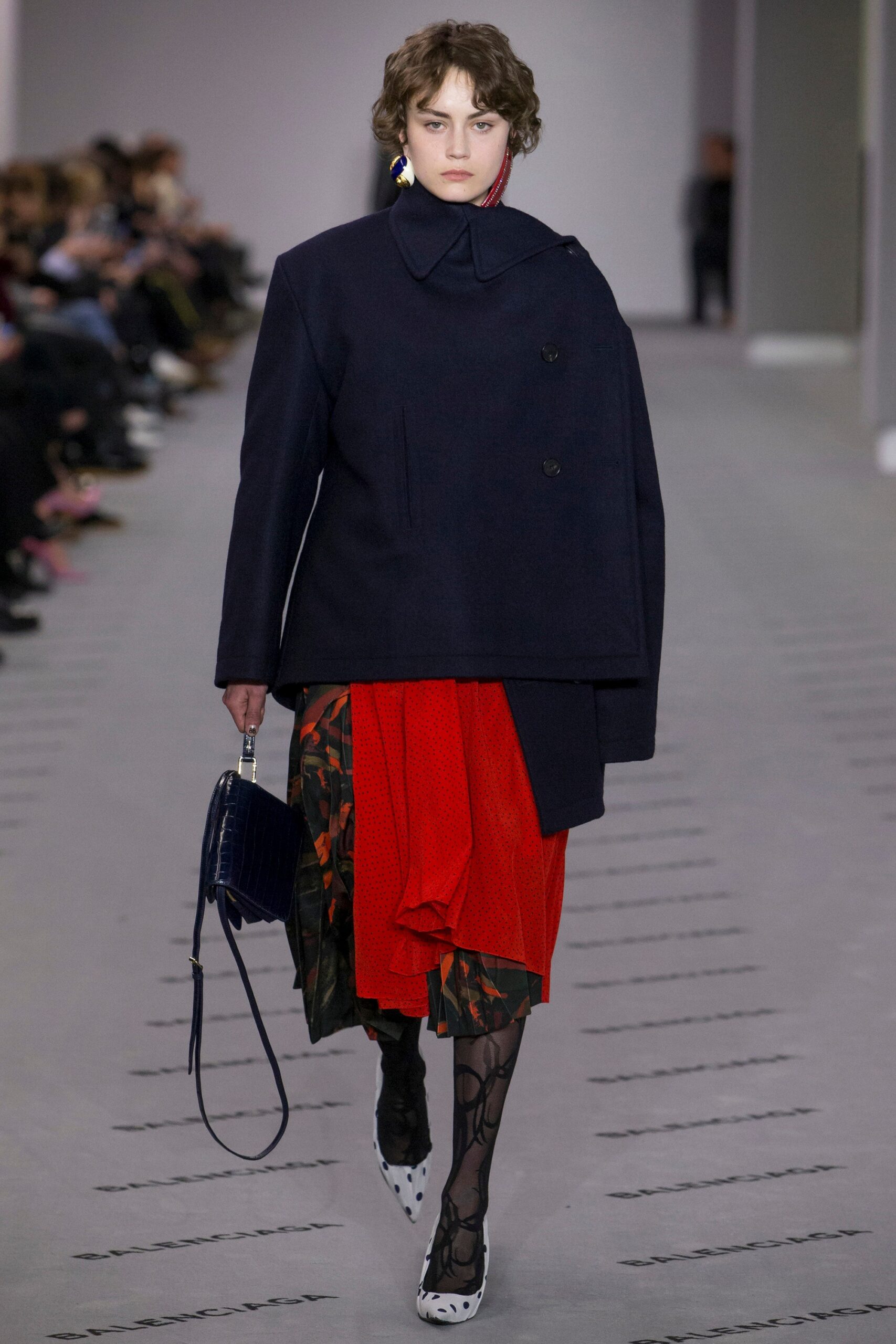 navy wool coat and red dress