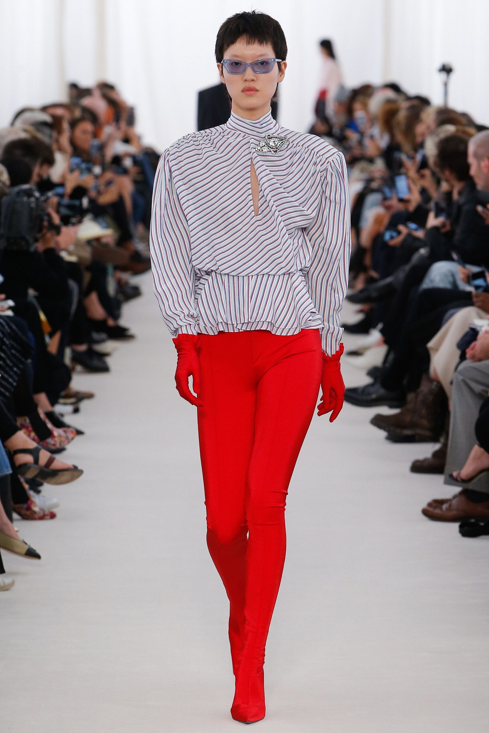 fitted striped blouse with red pants