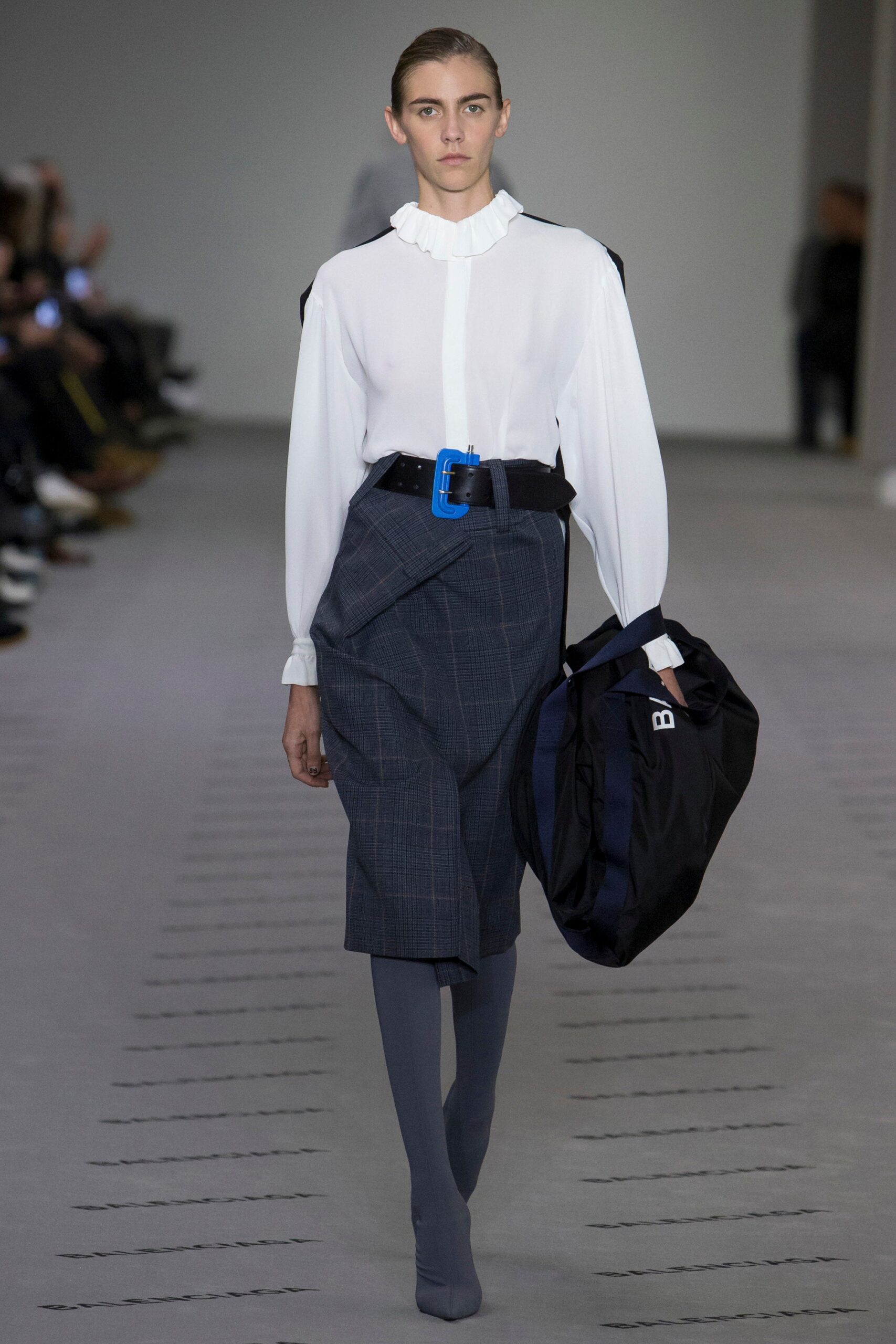 white silk blouse with blue skirt