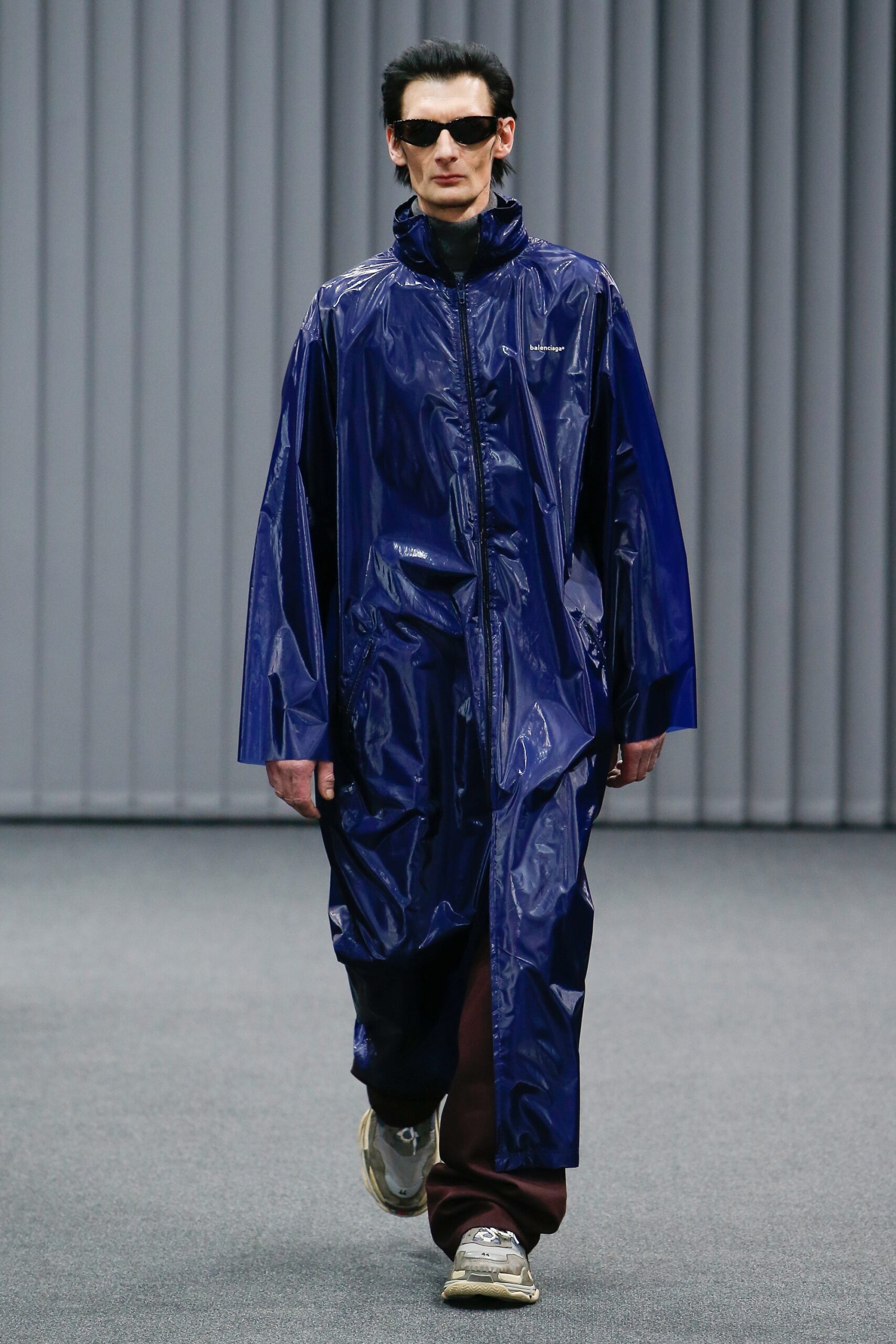 blue vinyl coat with brown pants