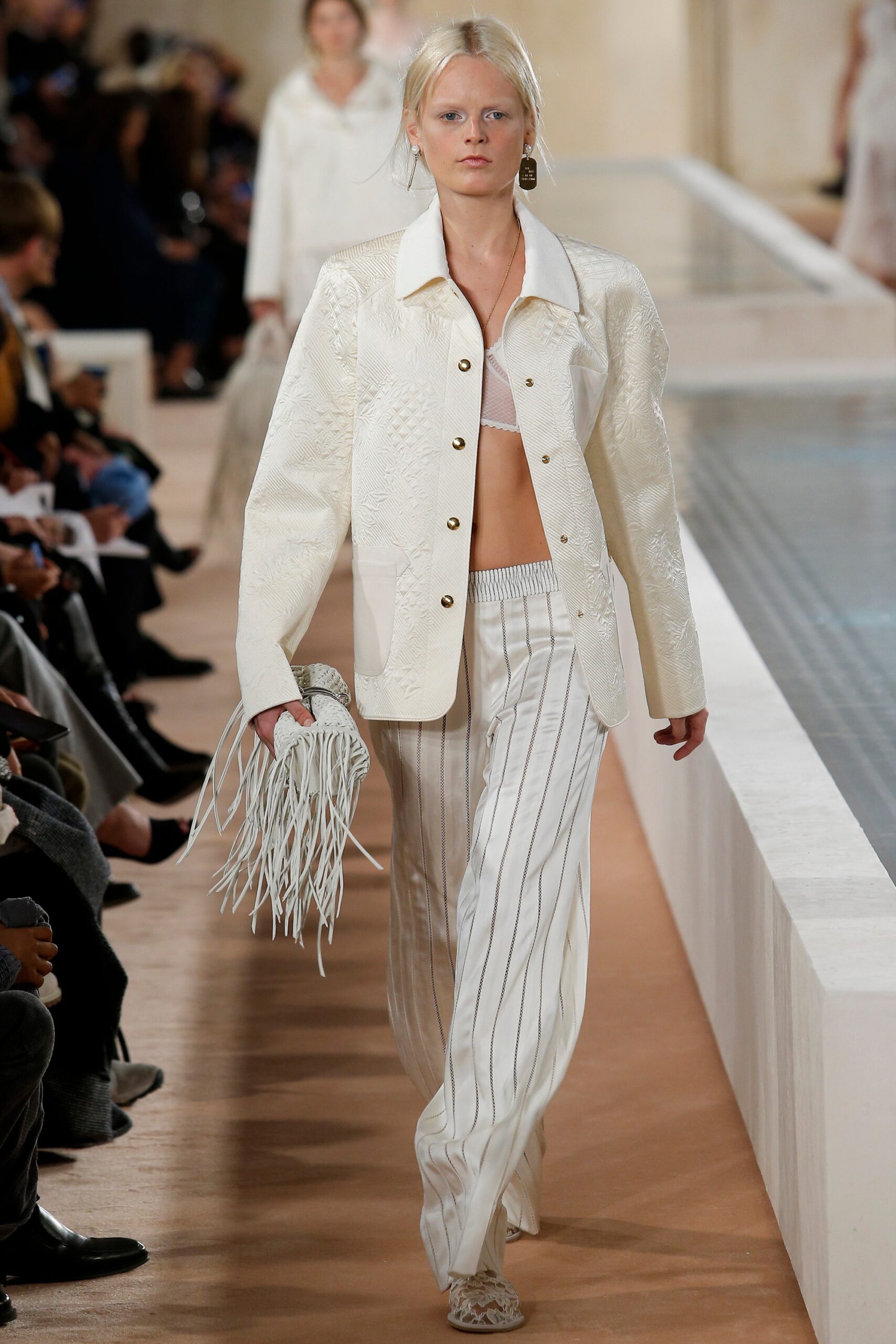 white relaxed jacket and fitted pants