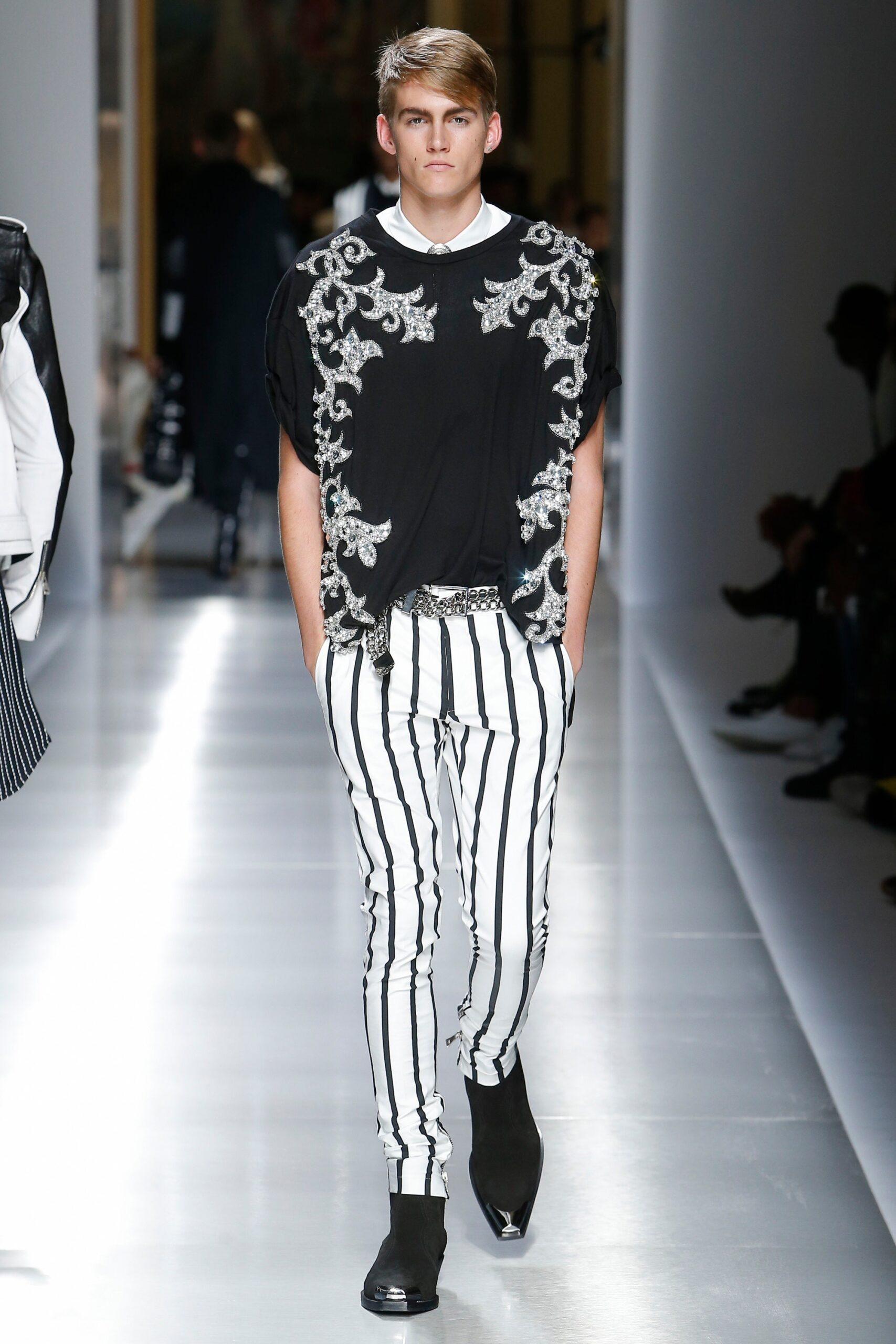 black embroidered top with striped pants