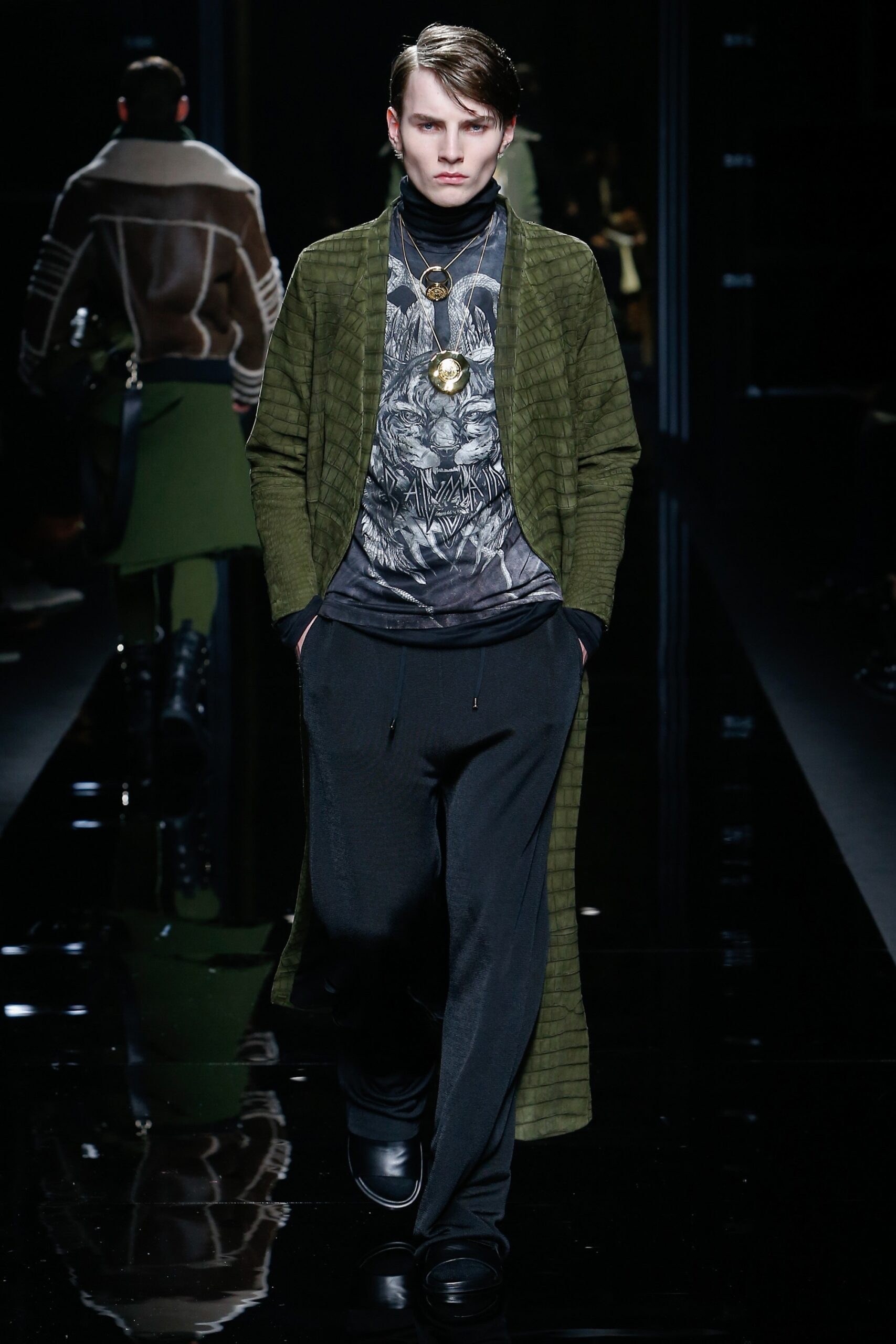 green coat gray top black pants