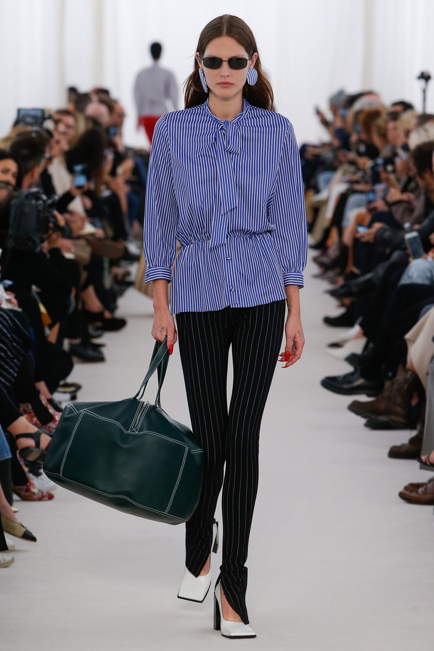 blue striped shirt with black pants