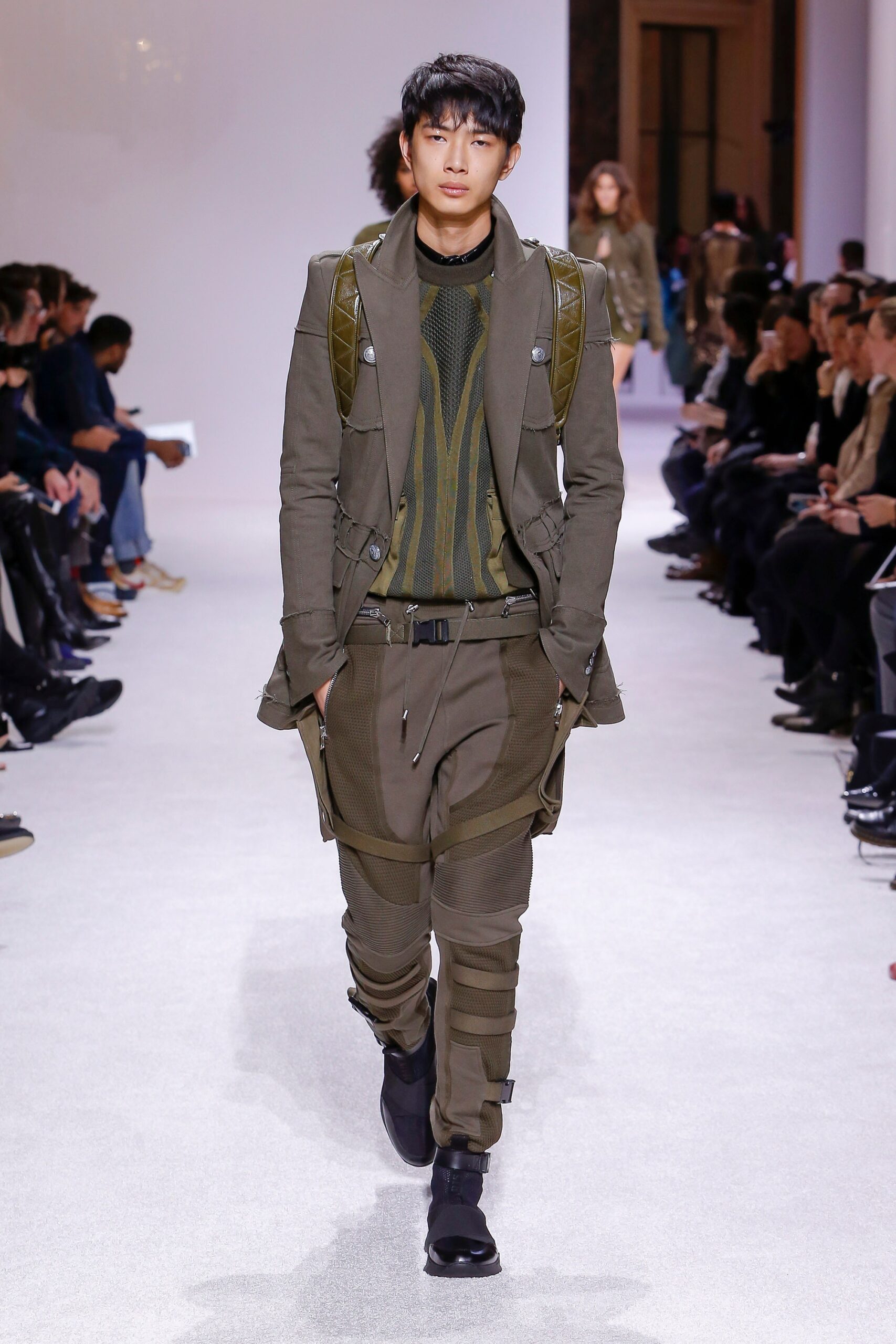 fitted green jacket with black sweater