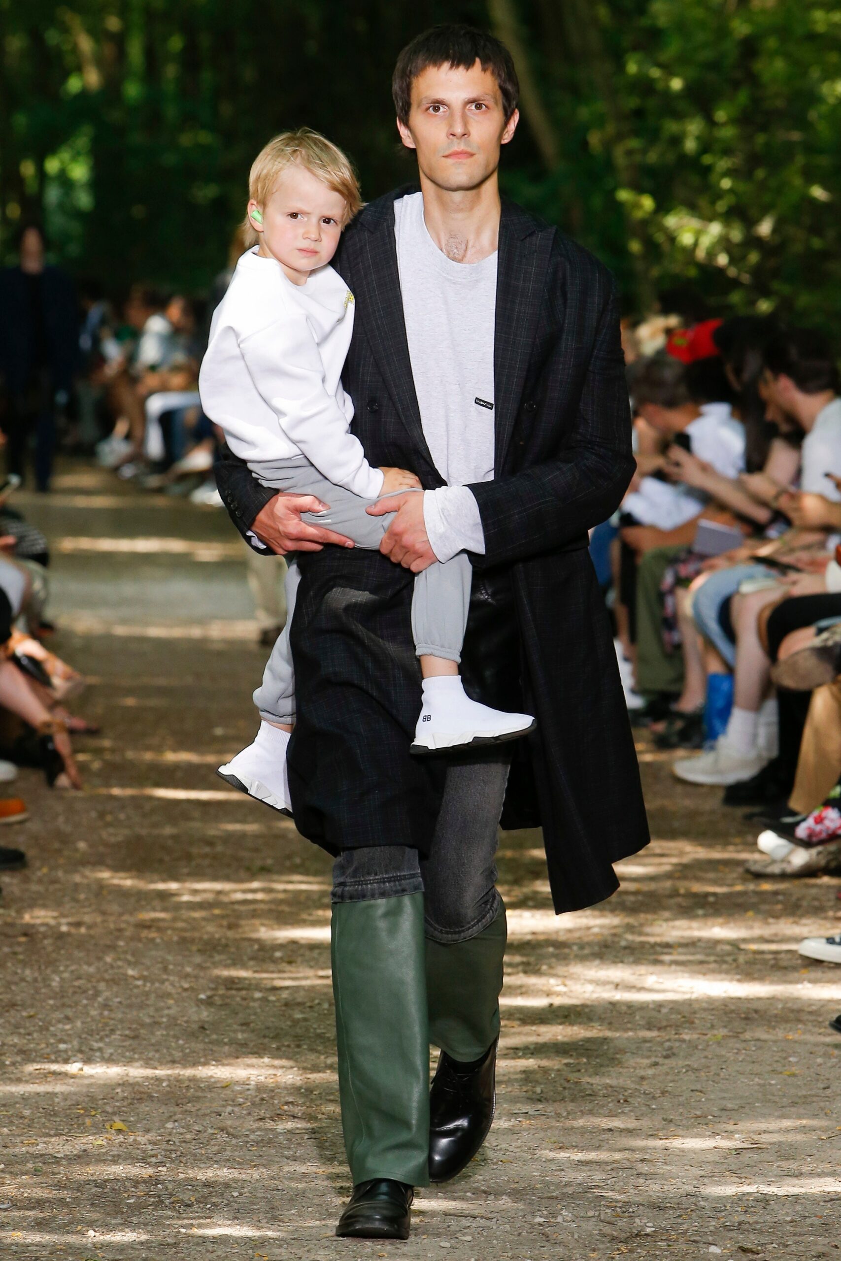 black coat with gray t-shirt and pants