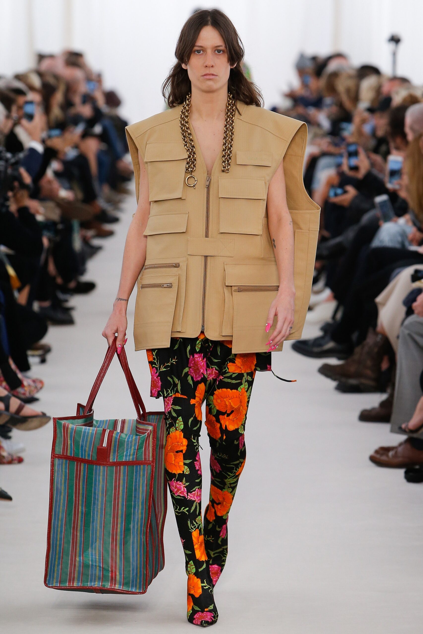 beige vest with floral pants