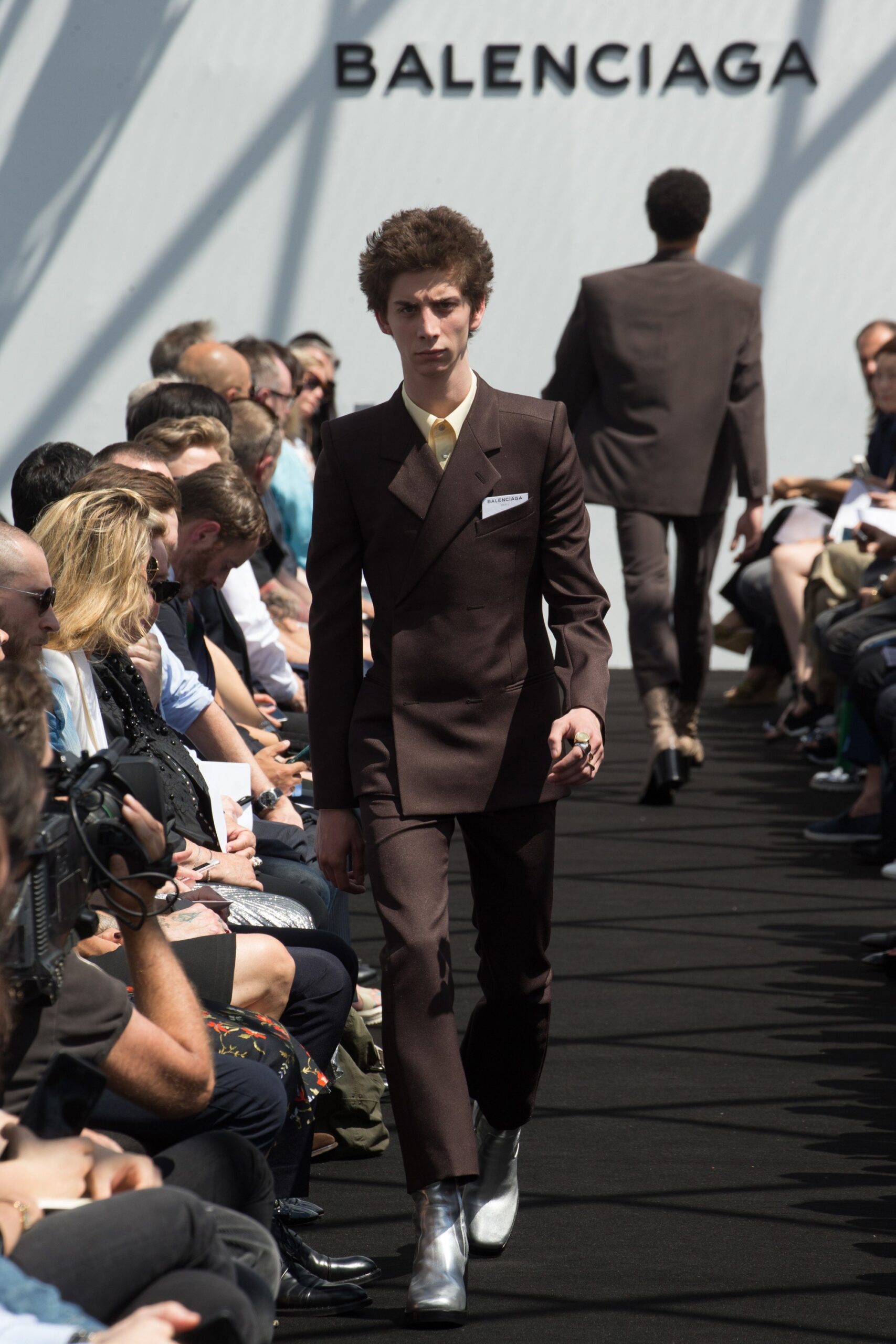 brown tailored suit with silver shoes