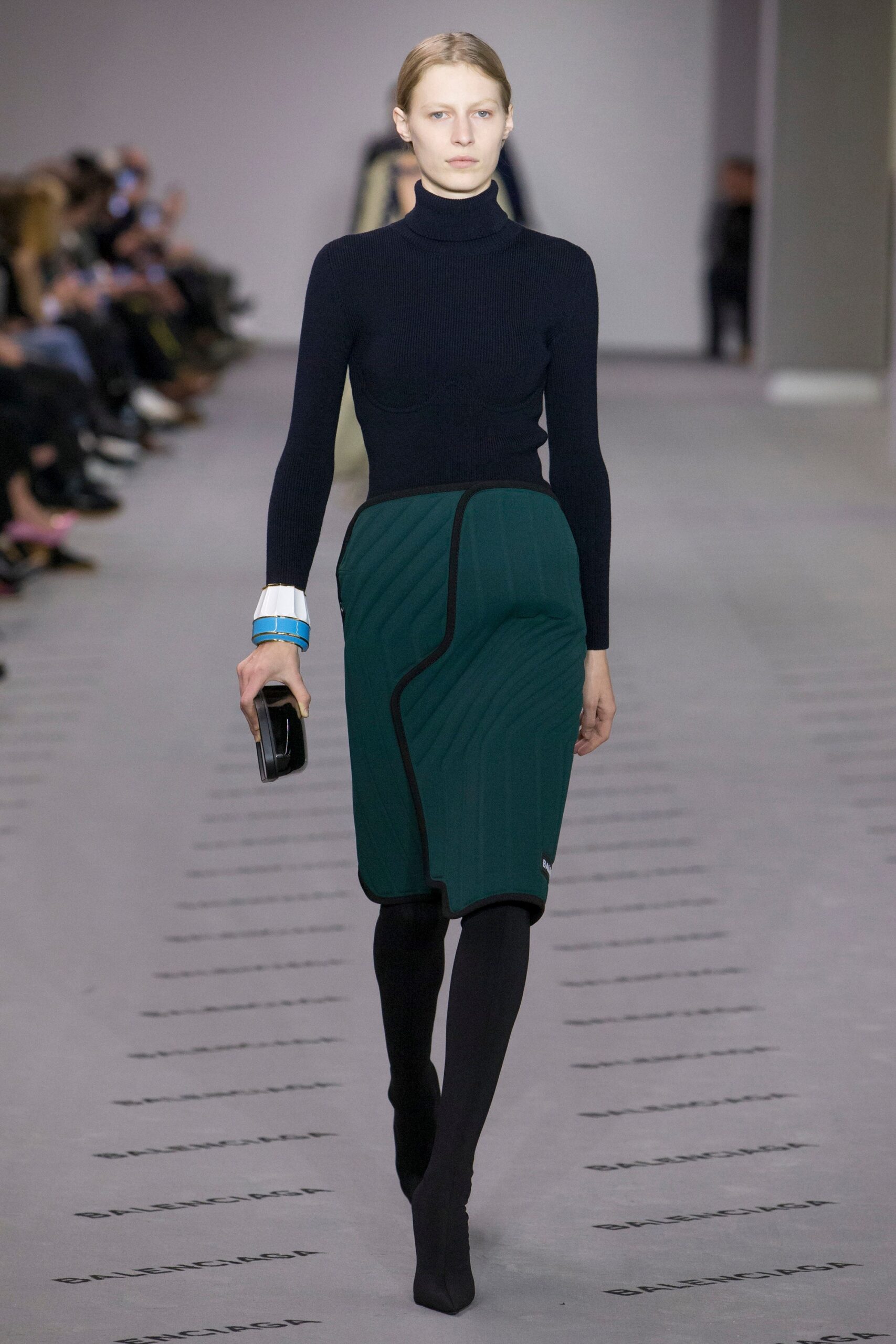 black fitted top green pleated skirt