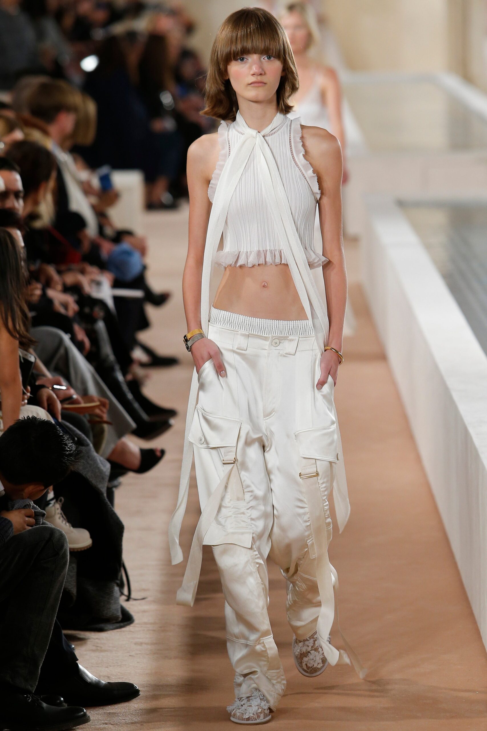 white pleated top and cargo pants