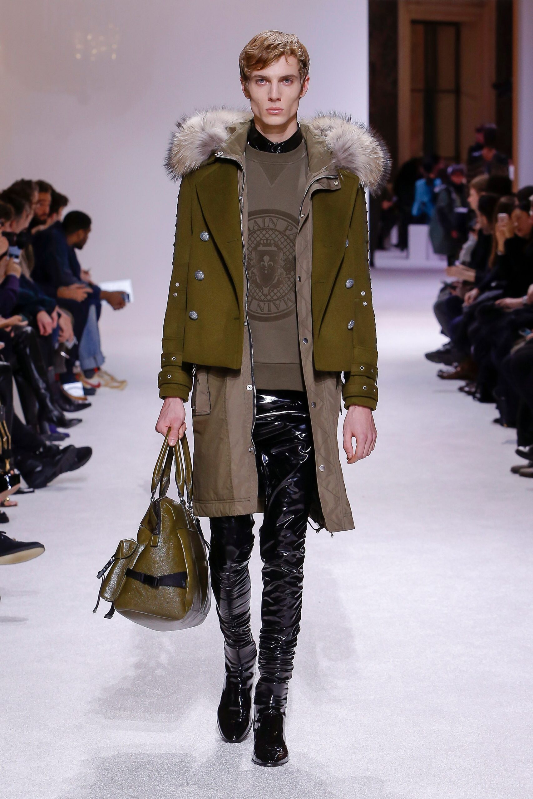 green parka with black vinyl pants