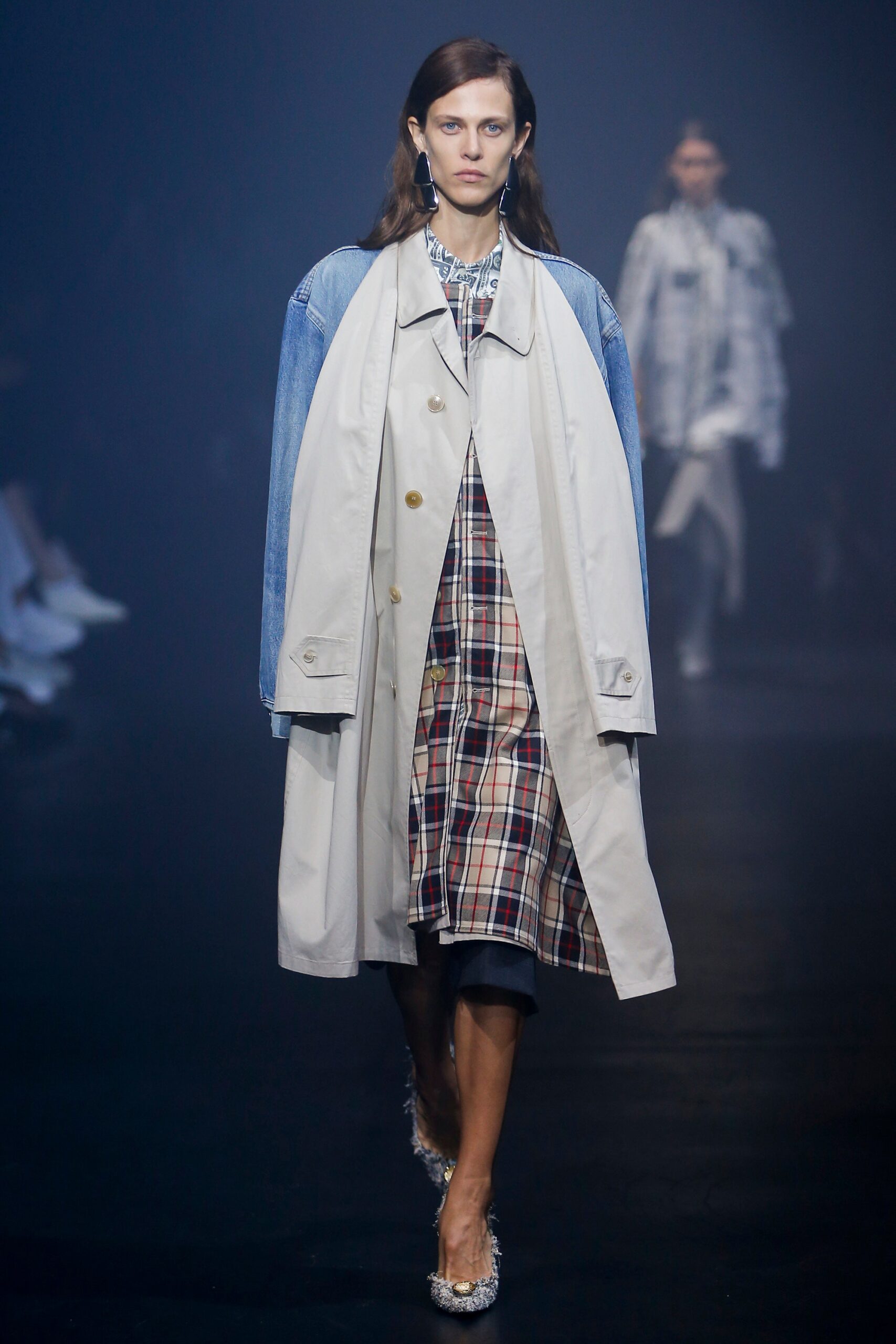 beige trench coat and checked dress
